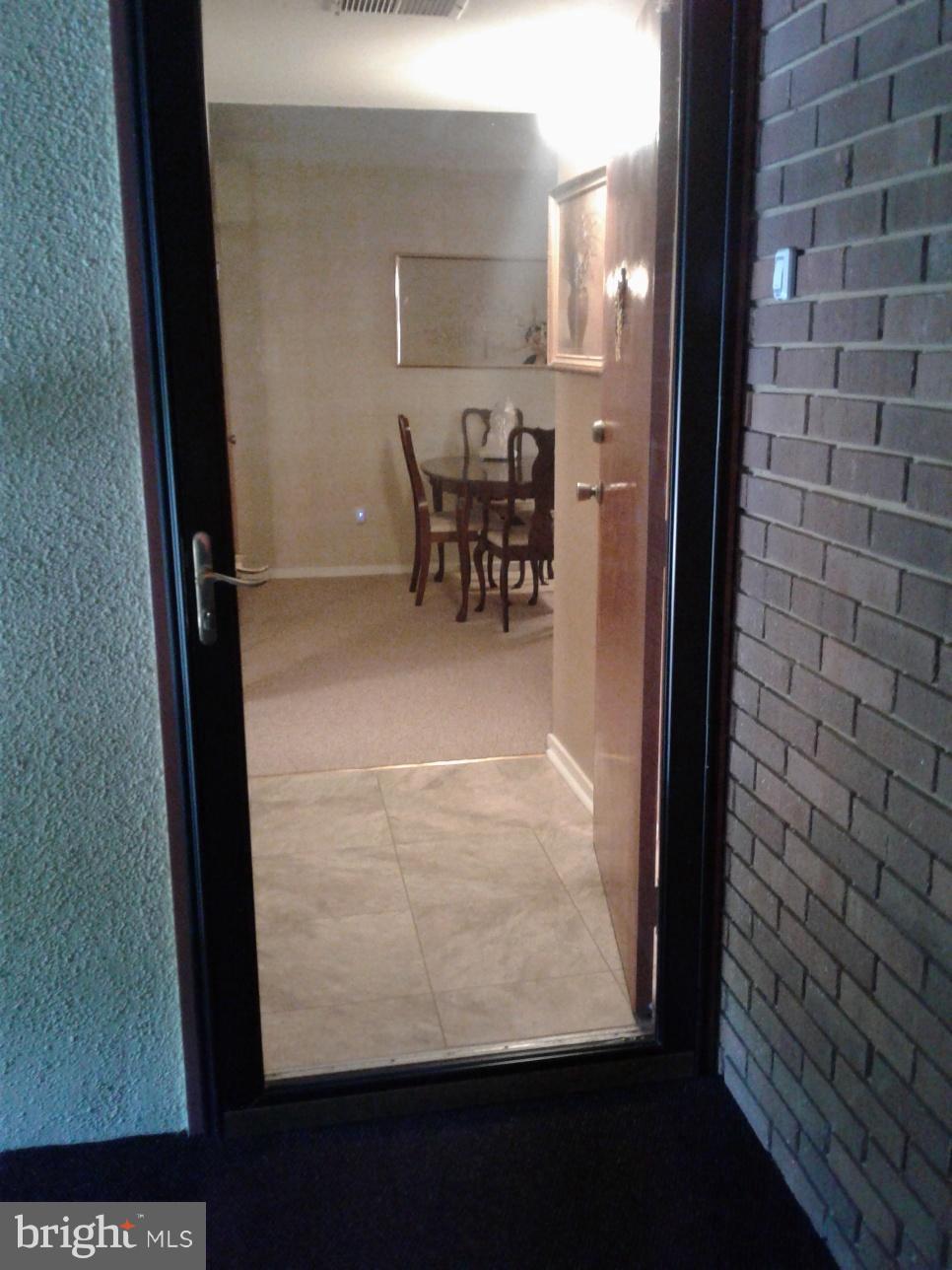 5717 Harpers Farm Road, Unit E Columbia, MD 21044 - Photo 2 of 21 a view of a room with a bench