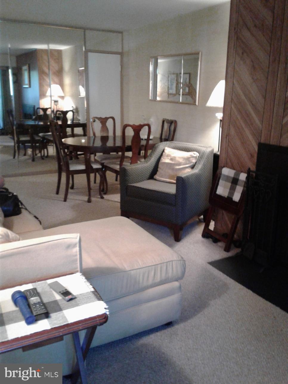 5717 Harpers Farm Road, Unit E Columbia, MD 21044 - Photo 12 of 21 a living room with furniture and view of kitchen