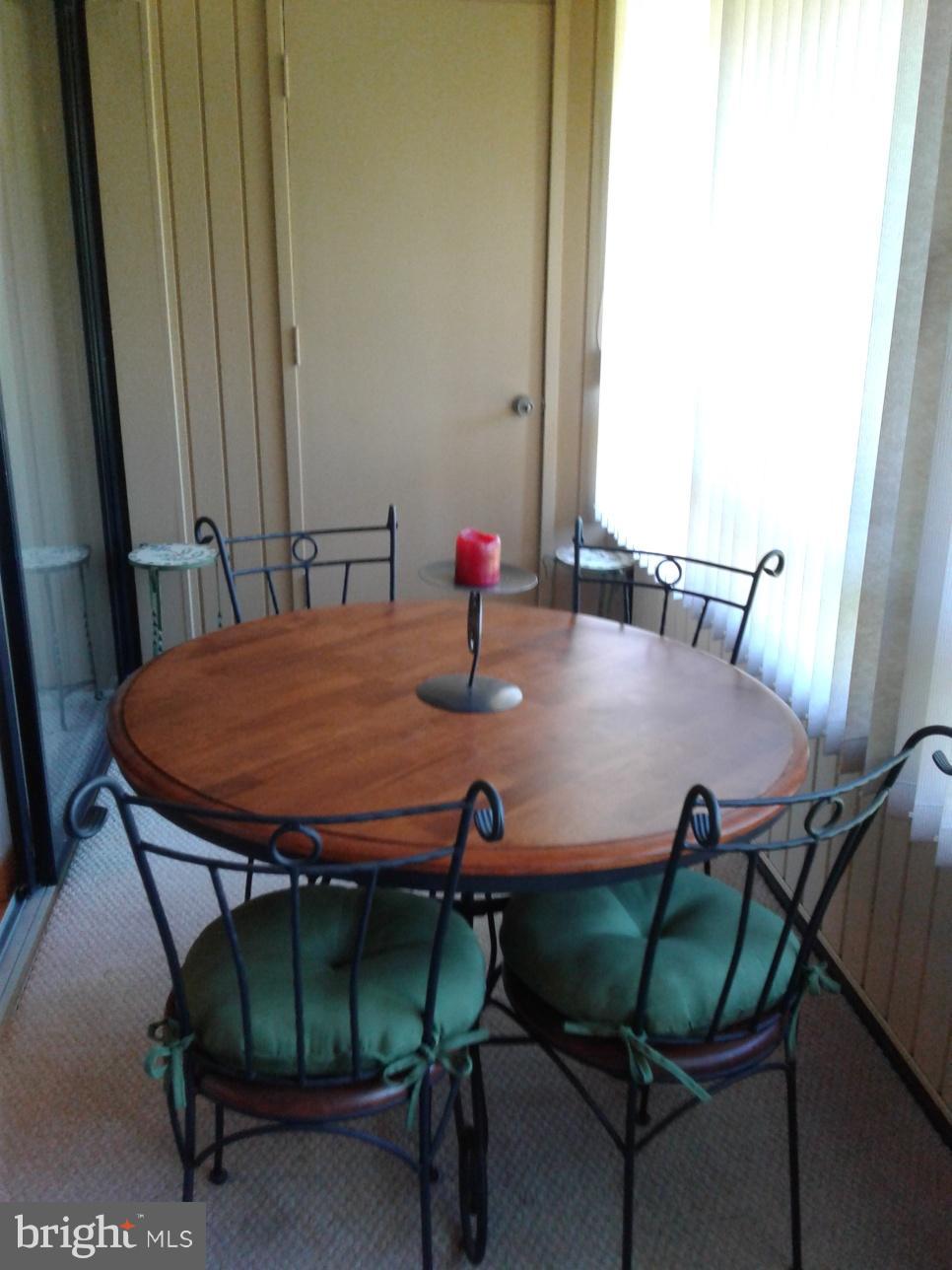 5717 Harpers Farm Road, Unit E Columbia, MD 21044 - Photo 13 of 21 a view of a dining room with furniture