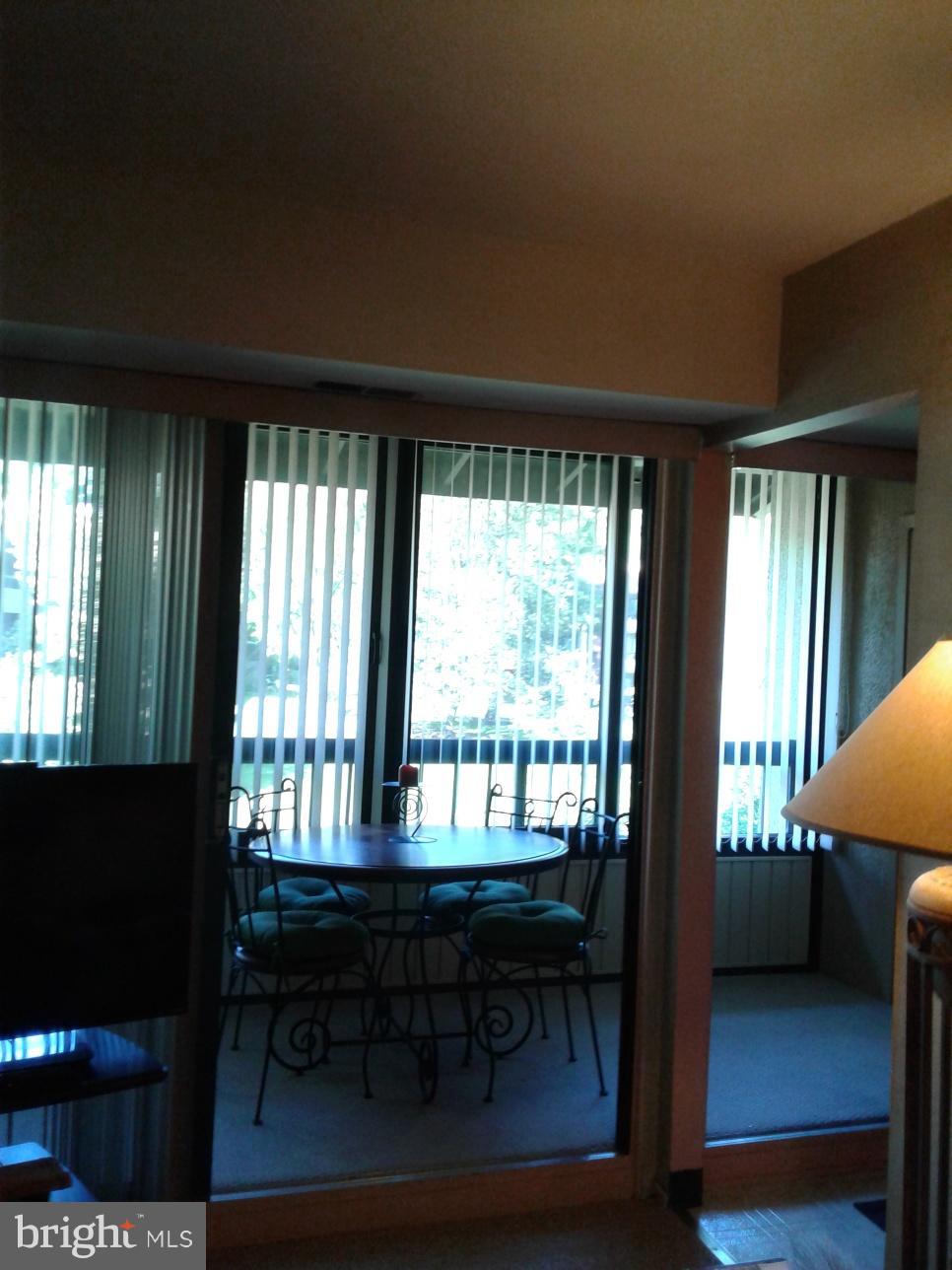5717 Harpers Farm Road, Unit E Columbia, MD 21044 - Photo 14 of 21 a room with furniture and a window