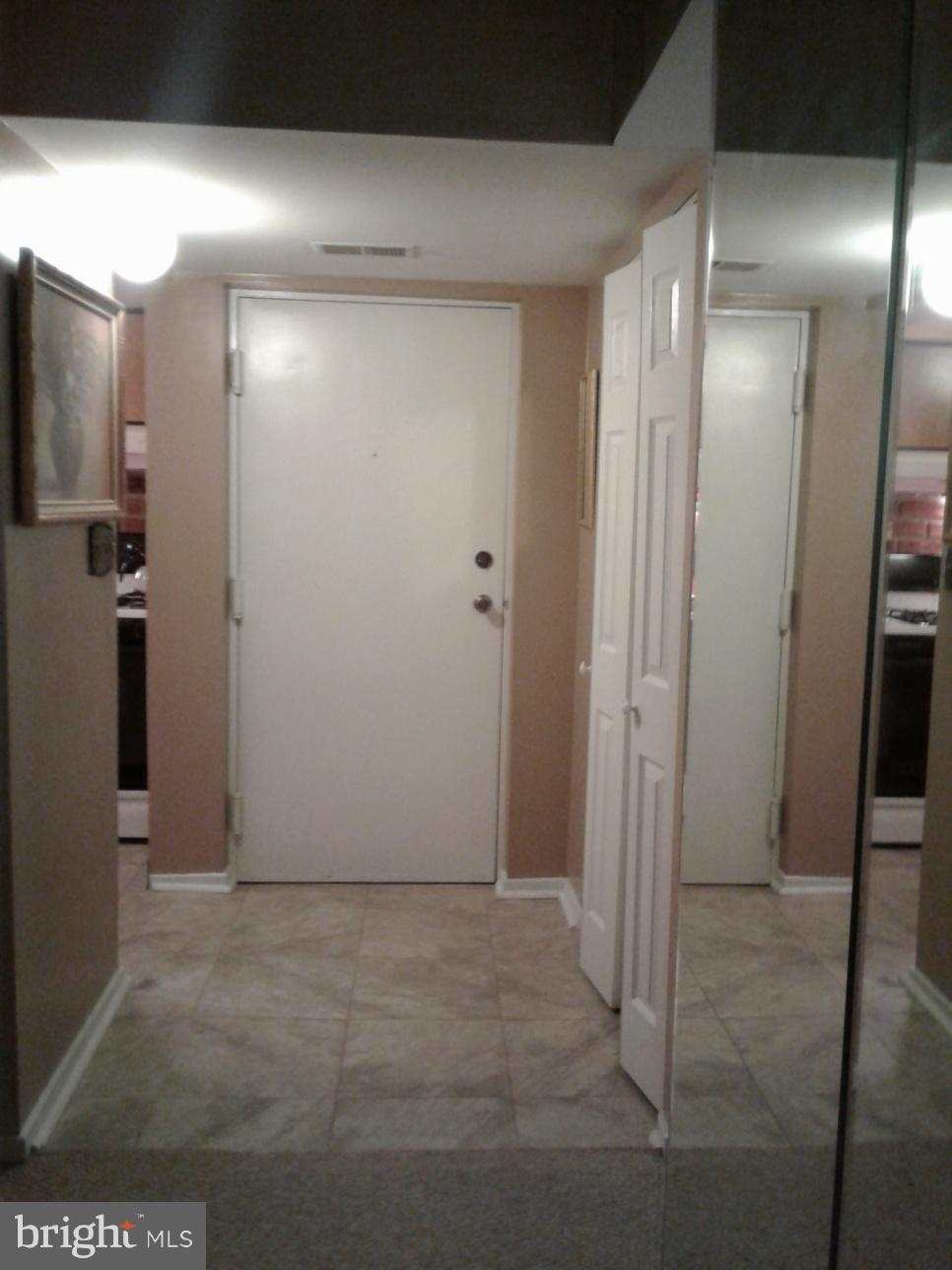 5717 Harpers Farm Road, Unit E Columbia, MD 21044 - Photo 3 of 21 a view of a room with wooden floor