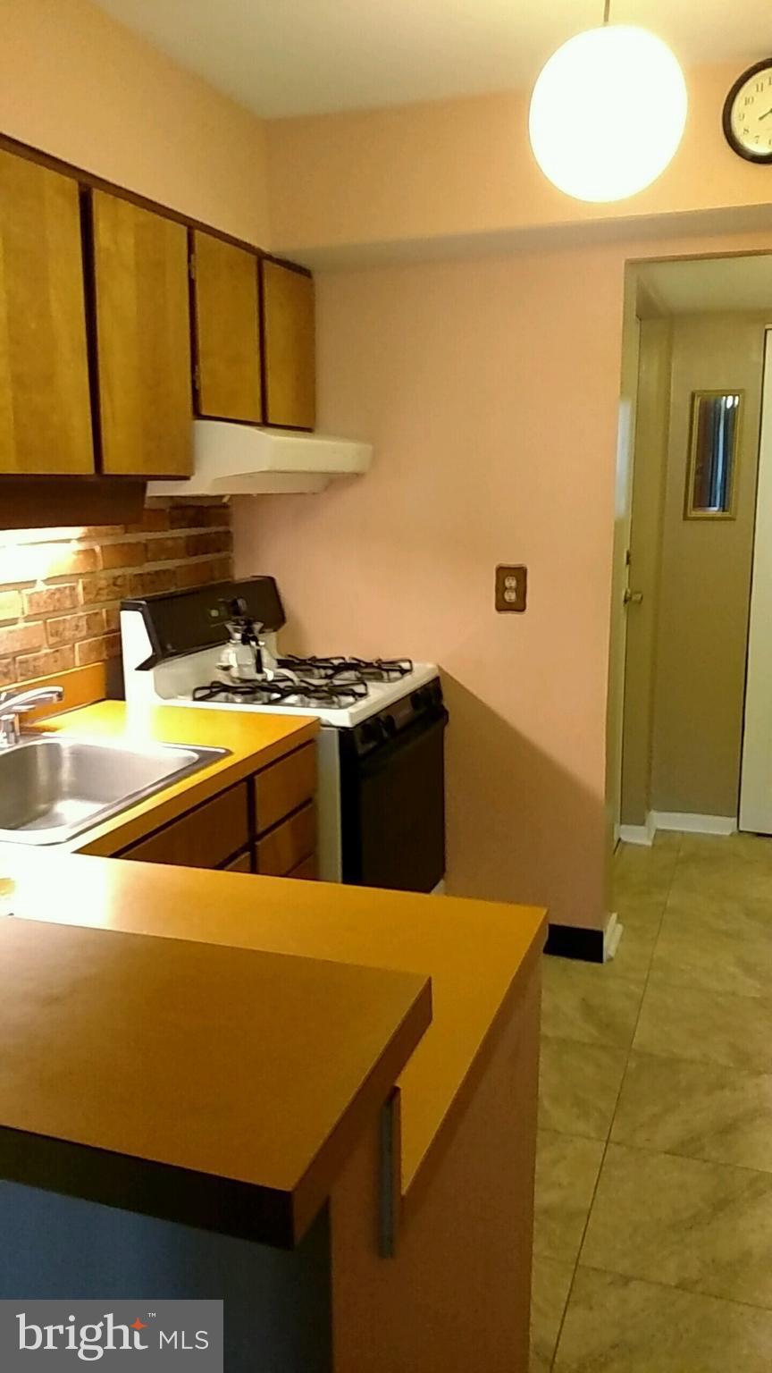 5717 Harpers Farm Road, Unit E Columbia, MD 21044 - Photo 5 of 21 a utility room with washer and dryer