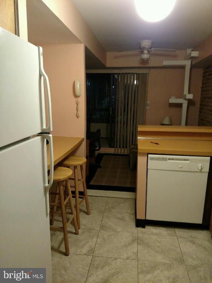 5717 Harpers Farm Road, Unit E Columbia, MD 21044 - Photo 6 of 21 a utility room with dryer and washer