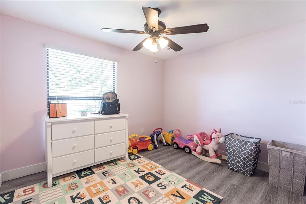 2345 Outrigger Lane Naples, FL 34104 - Photo 18 of 37 a room with furniture and window