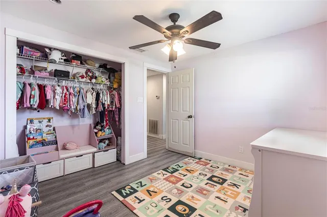 a view of a livingroom with furniture and closet