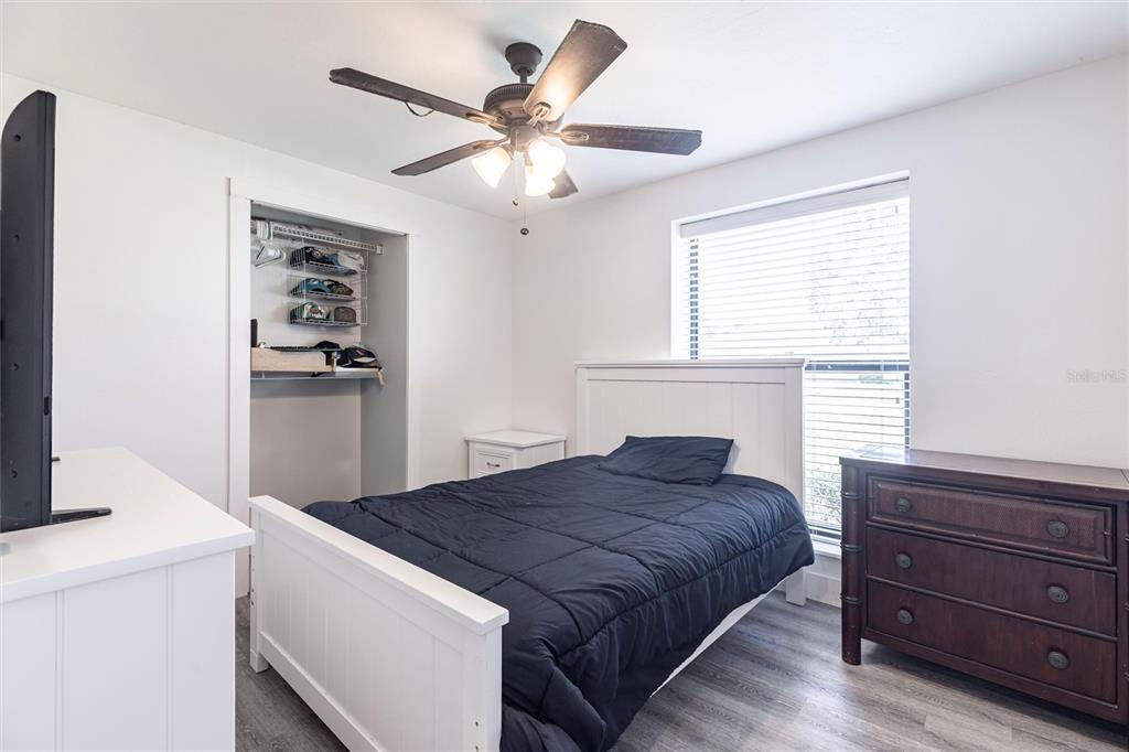 2345 Outrigger Lane Naples, FL 34104 - Photo 21 of 37 a bedroom with a bed and a window