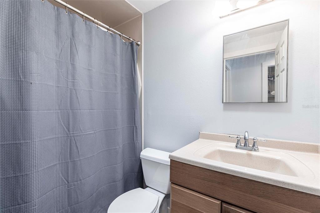 2345 Outrigger Lane Naples, FL 34104 - Photo 23 of 37 a bathroom with a sink a toilet and shower