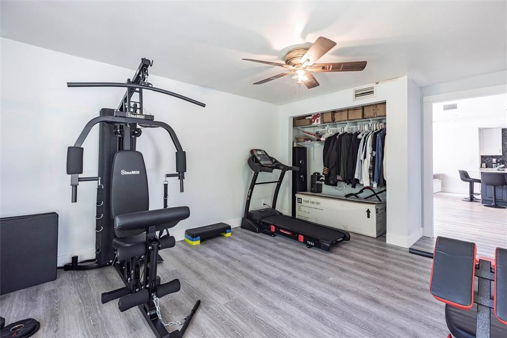 2345 Outrigger Lane Naples, FL 34104 - Photo 25 of 37 a view of a room with gym equipment