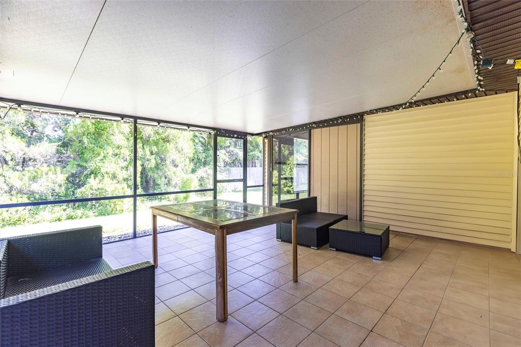 2345 Outrigger Lane Naples, FL 34104 - Photo 27 of 37 a view of a floor to ceiling window in an empty room