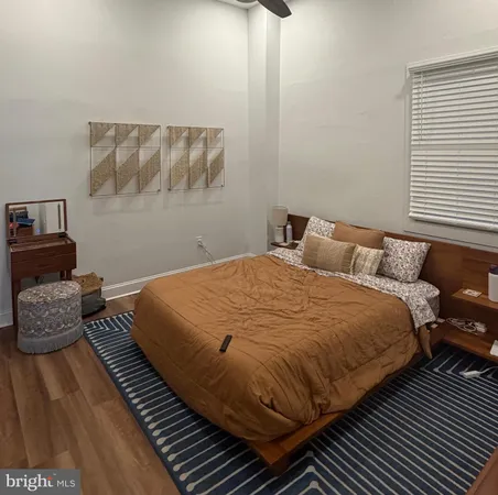 a bedroom with bed and window