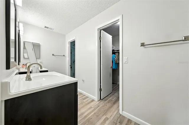 a bathroom with a toilet sink and shower