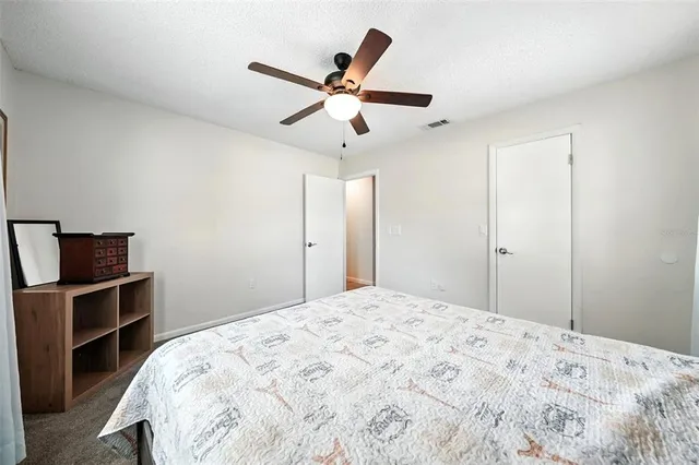 a bedroom with a bed and a cabinets