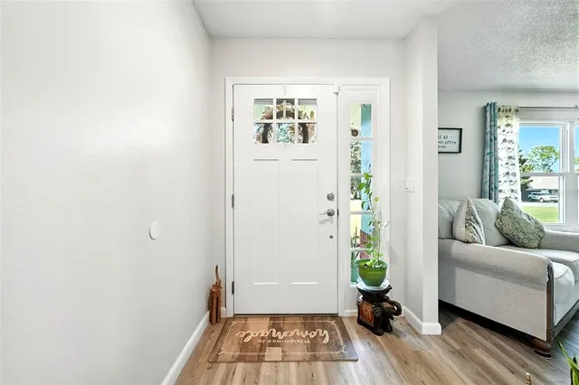 a bedroom with furniture and large windows
