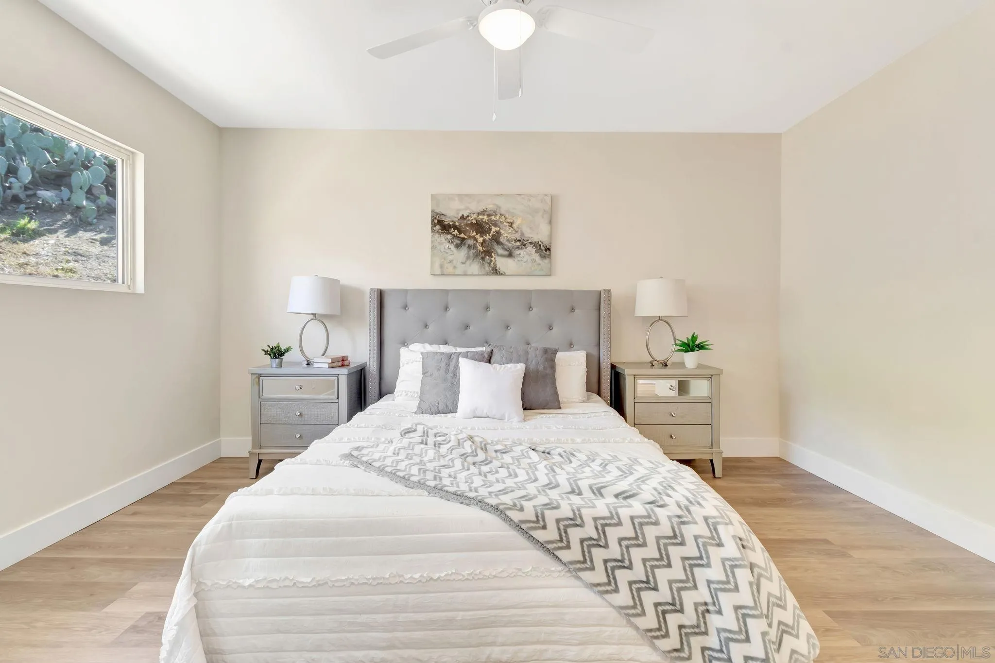 9188 Valencia Street Spring Valley, CA 91977 - Photo 18 of 27 a bedroom with a bed and a table