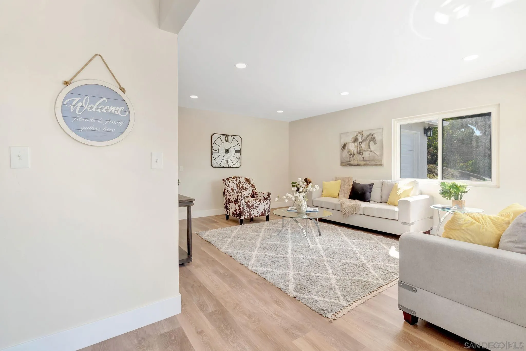 9188 Valencia Street Spring Valley, CA 91977 - Photo 5 of 27 a living room with furniture and a table