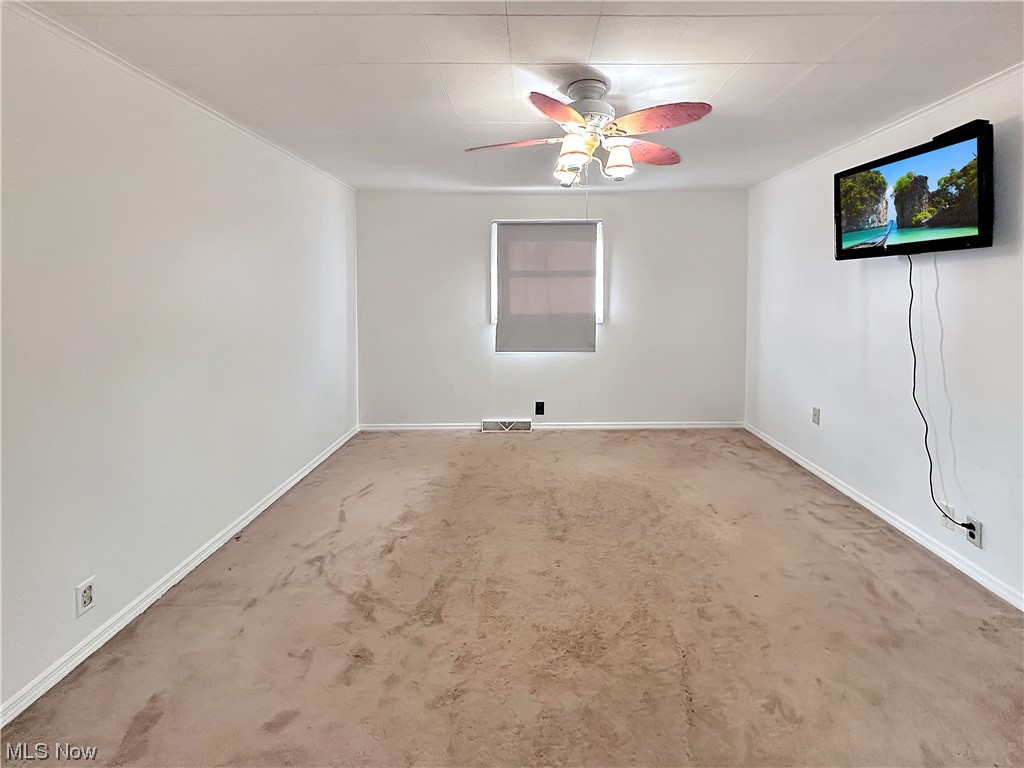 2692 Race Track Road New Cumberland, WV 26047 - Photo 14 of 25 Carpeted empty room with ceiling fan