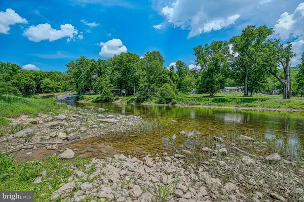 a view of a lake with a big yard
