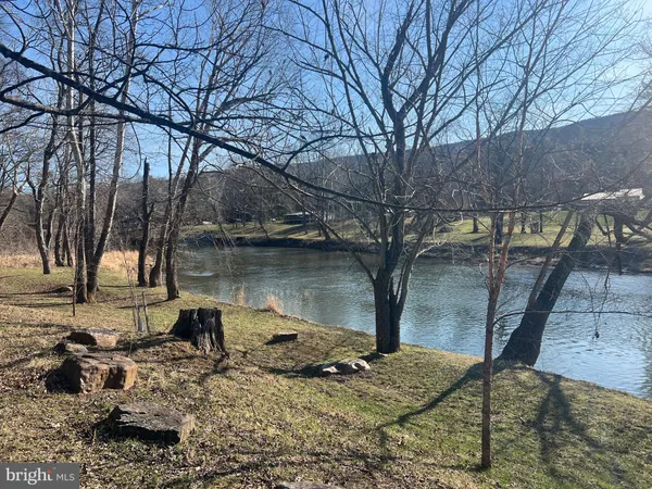 a lake view with a bench