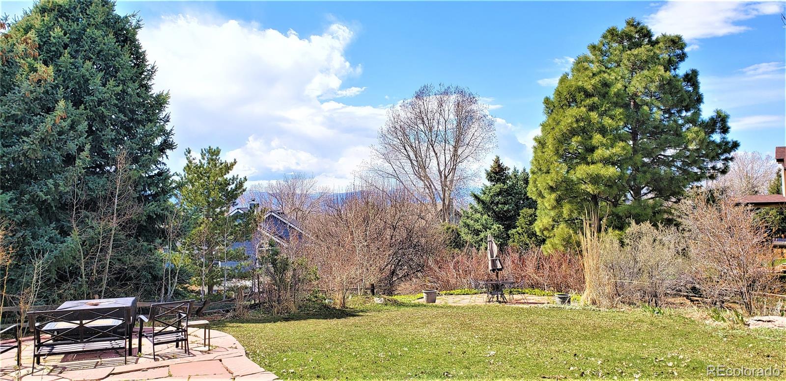 Mountain Views & Lush, Private 1/4 acre lot. Made for entertaining Spacious Deck next to house + Expanded Flagstone Patio by deck + 2nd Flagstone Patio encircled with lush privacy bushes- *All perfect for entertaining!
