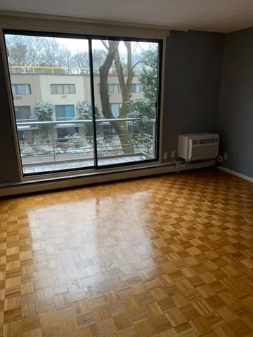 a view of lot of an empty room with a window