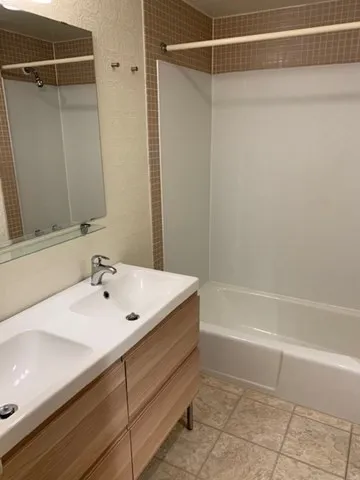 a bathroom with a sink and mirror