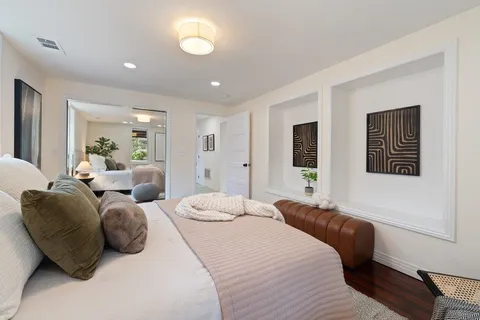 a bed room with a bed and furniture