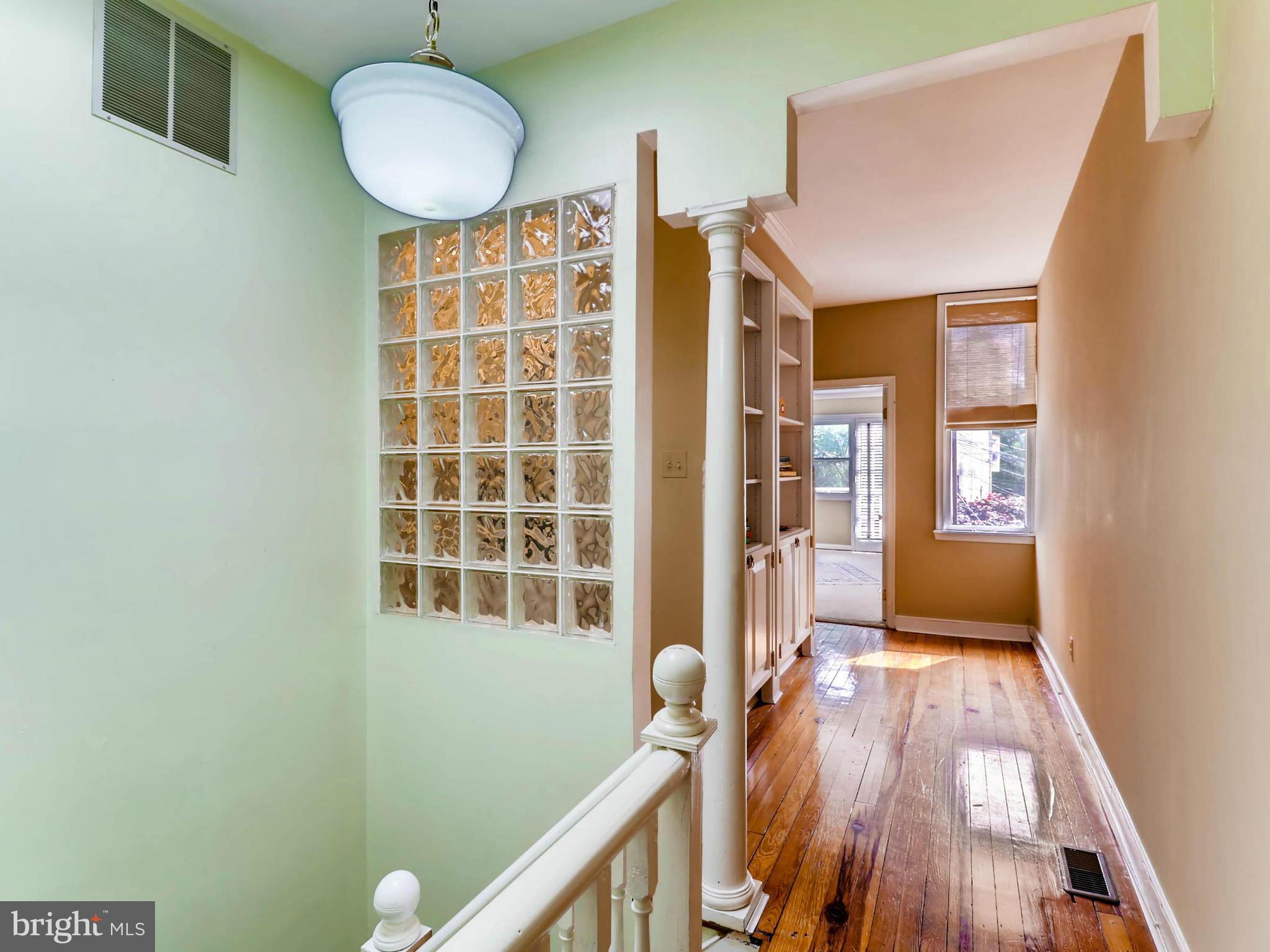 1037 Riverside Avenue Baltimore, MD 21230 - Photo 14 of 30 2nd level landing with original glass