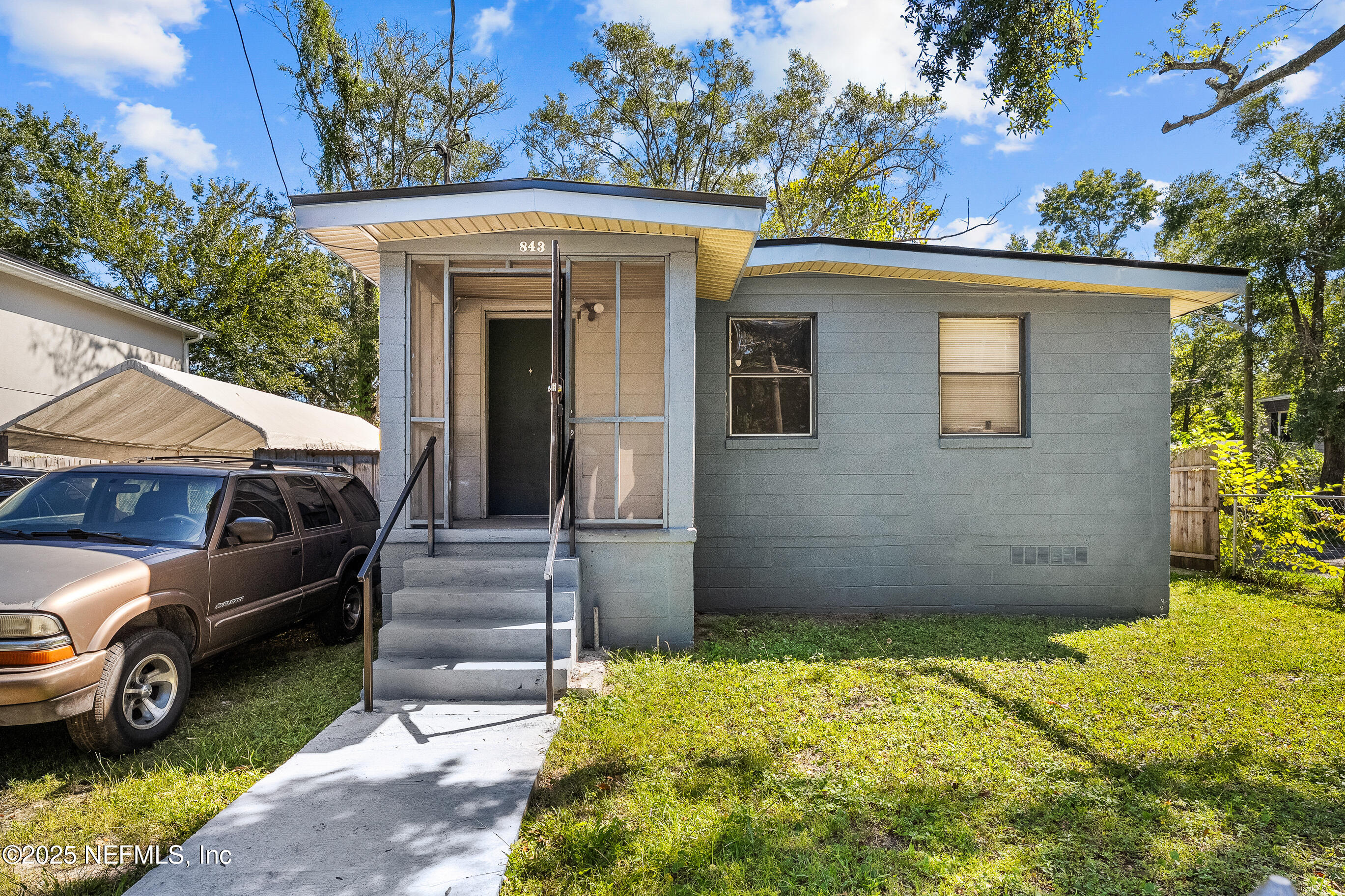 843 Line Street Jacksonville, FL 32209 - Photo 1 of 13 a view of a car in front of a house
