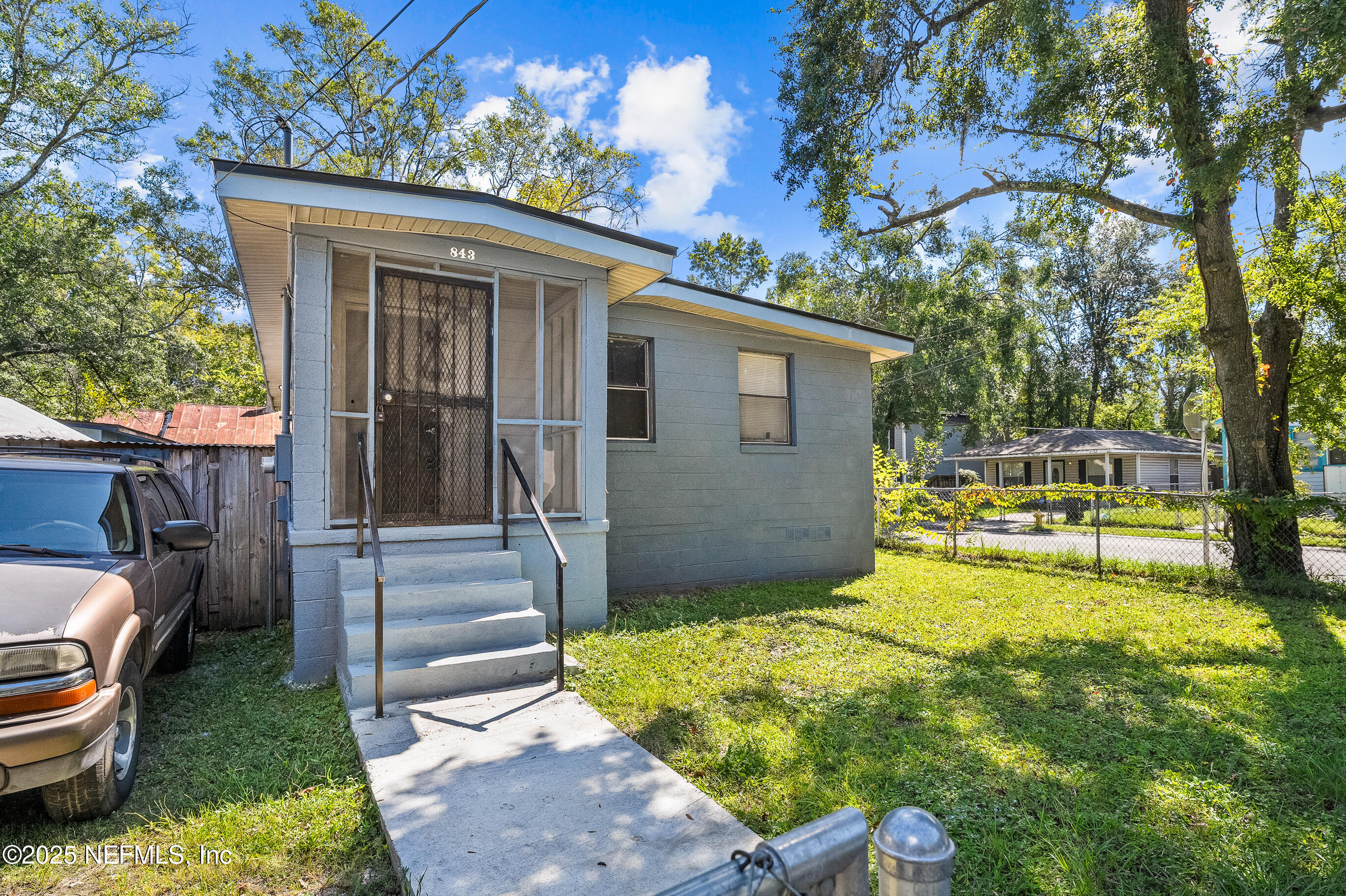 843 Line Street Jacksonville, FL 32209 - Photo 2 of 13 a view of a house with swimming pool in back
