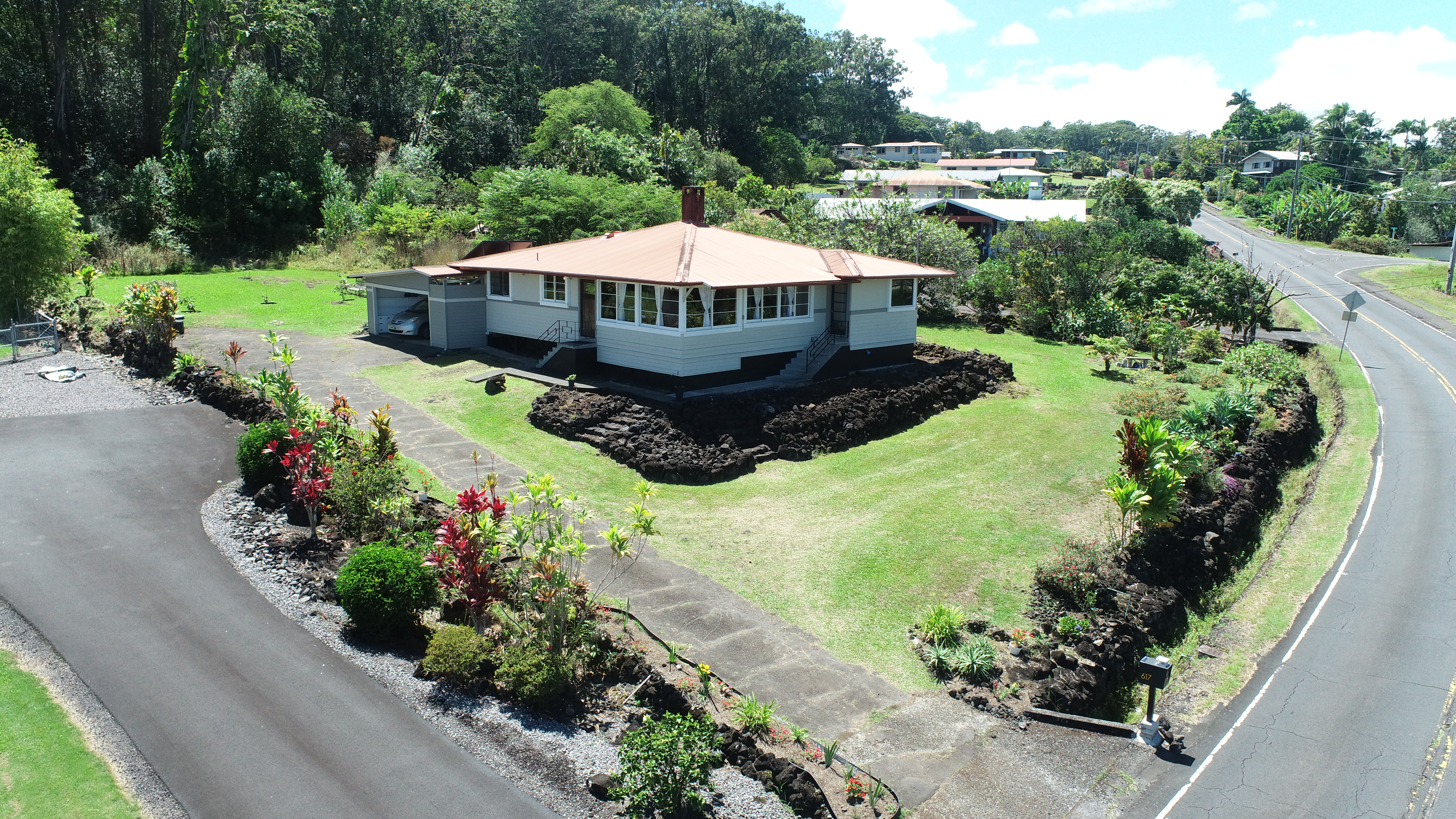 617 Ainako Avenue, Unit 1 Hilo, HI 96720 - Photo 1 of 29 a view of a garden with pathway