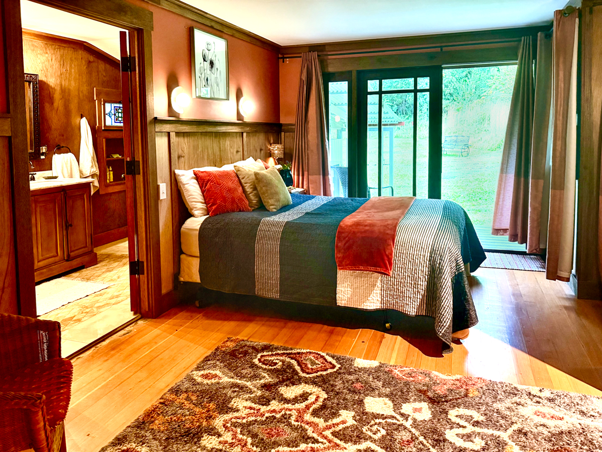 617 Ainako Avenue, Unit 1 Hilo, HI 96720 - Photo 13 of 29 a bed sitting in a bedroom next to a window