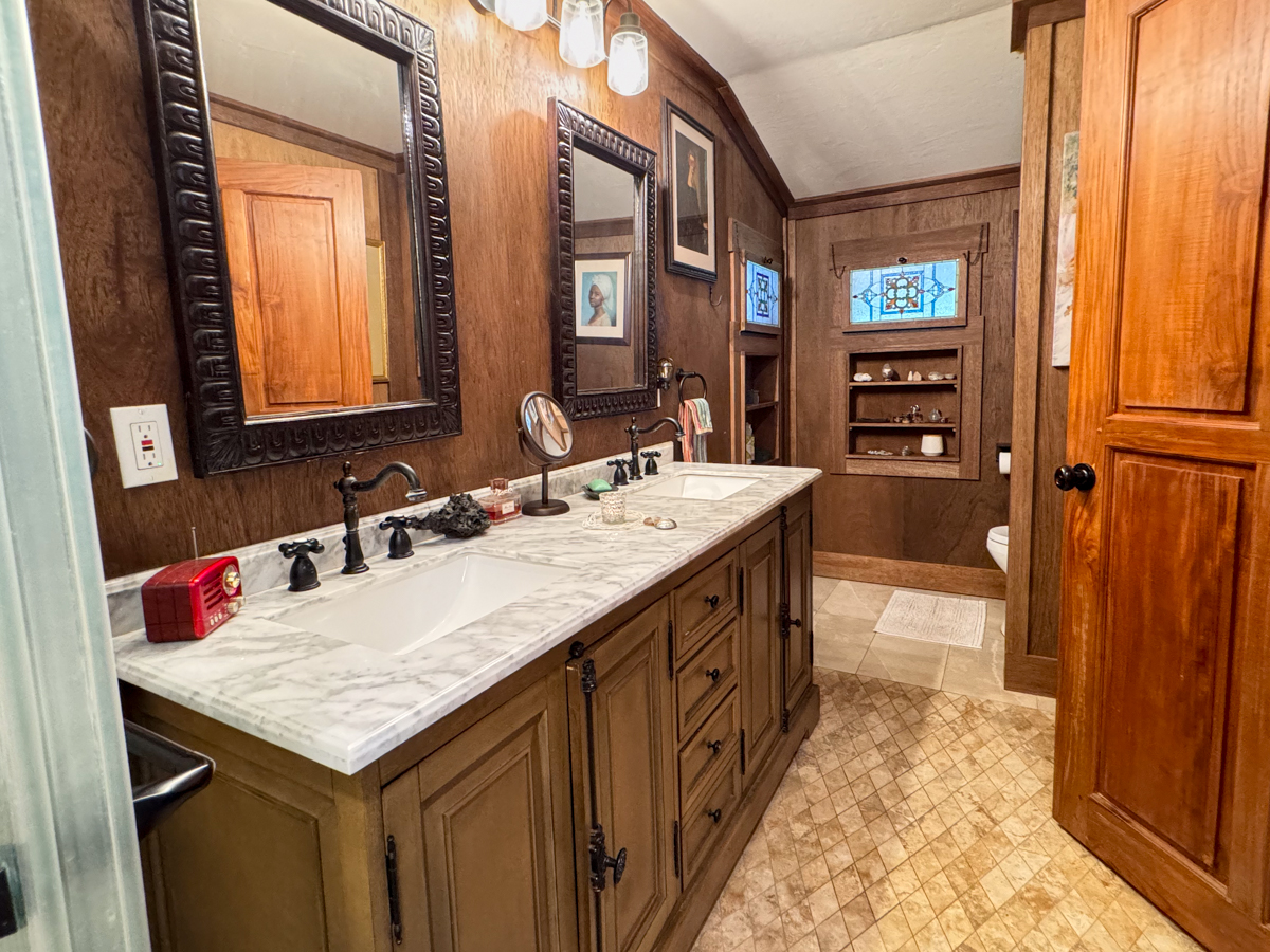 617 Ainako Avenue, Unit 1 Hilo, HI 96720 - Photo 15 of 29 a bathroom with a sink double vanity and a mirror