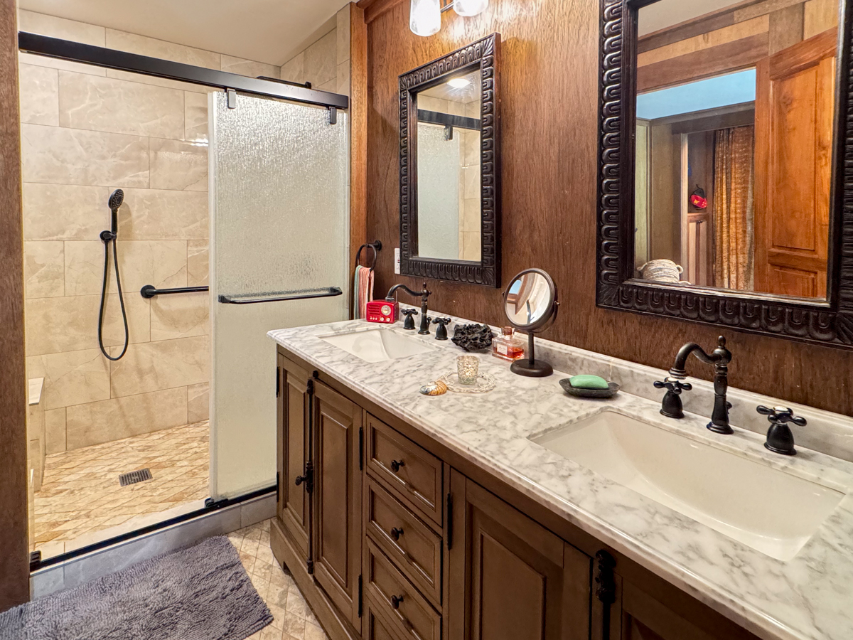 617 Ainako Avenue, Unit 1 Hilo, HI 96720 - Photo 16 of 29 a bathroom with a granite countertop sink and a mirror