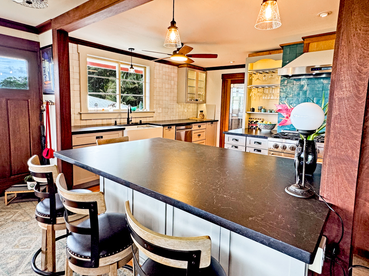 617 Ainako Avenue, Unit 1 Hilo, HI 96720 - Photo 6 of 29 a view of a dining room with furniture a chandelier and wooden floor