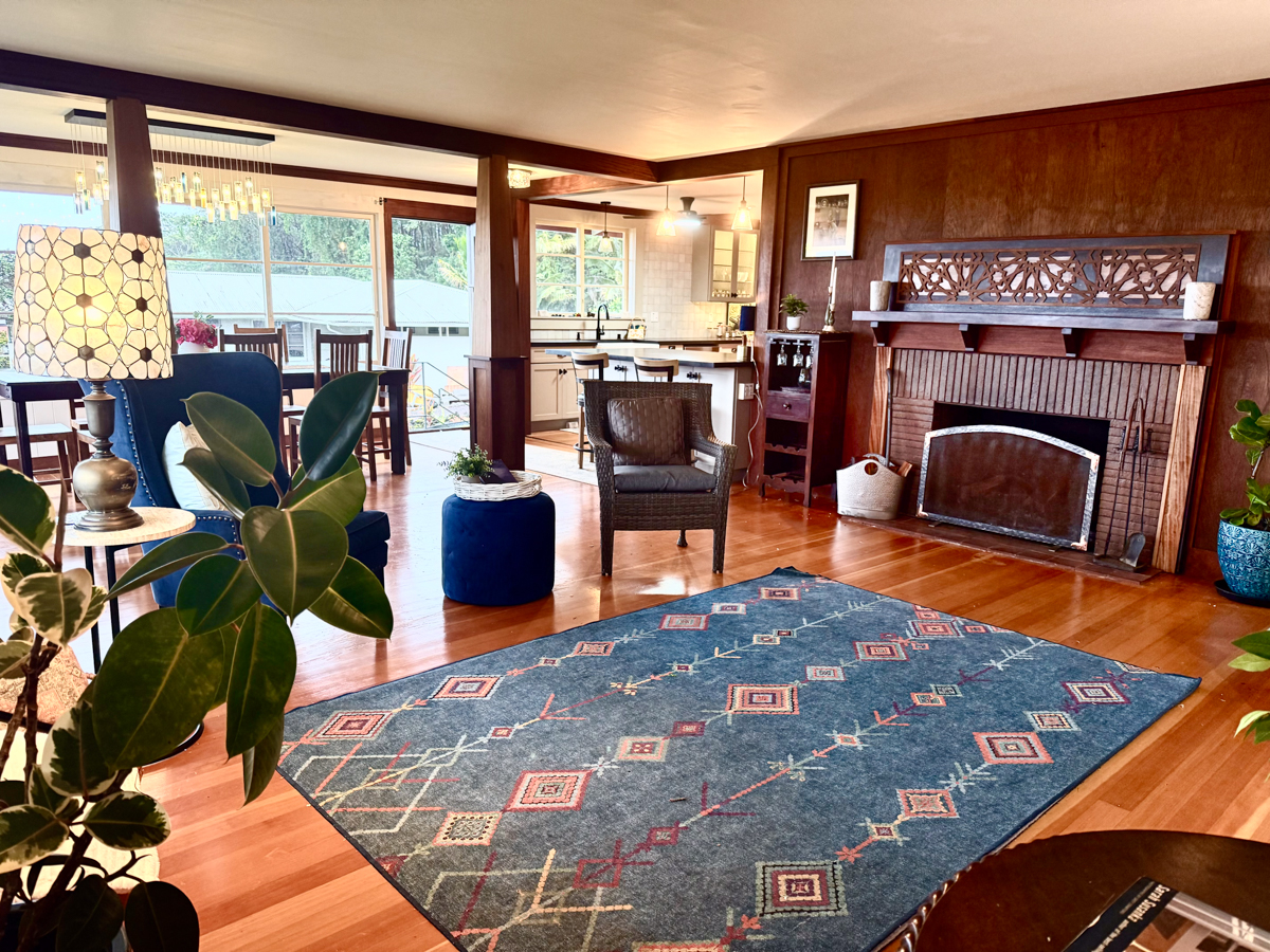 617 Ainako Avenue, Unit 1 Hilo, HI 96720 - Photo 8 of 29 a living room with furniture a rug and a fireplace