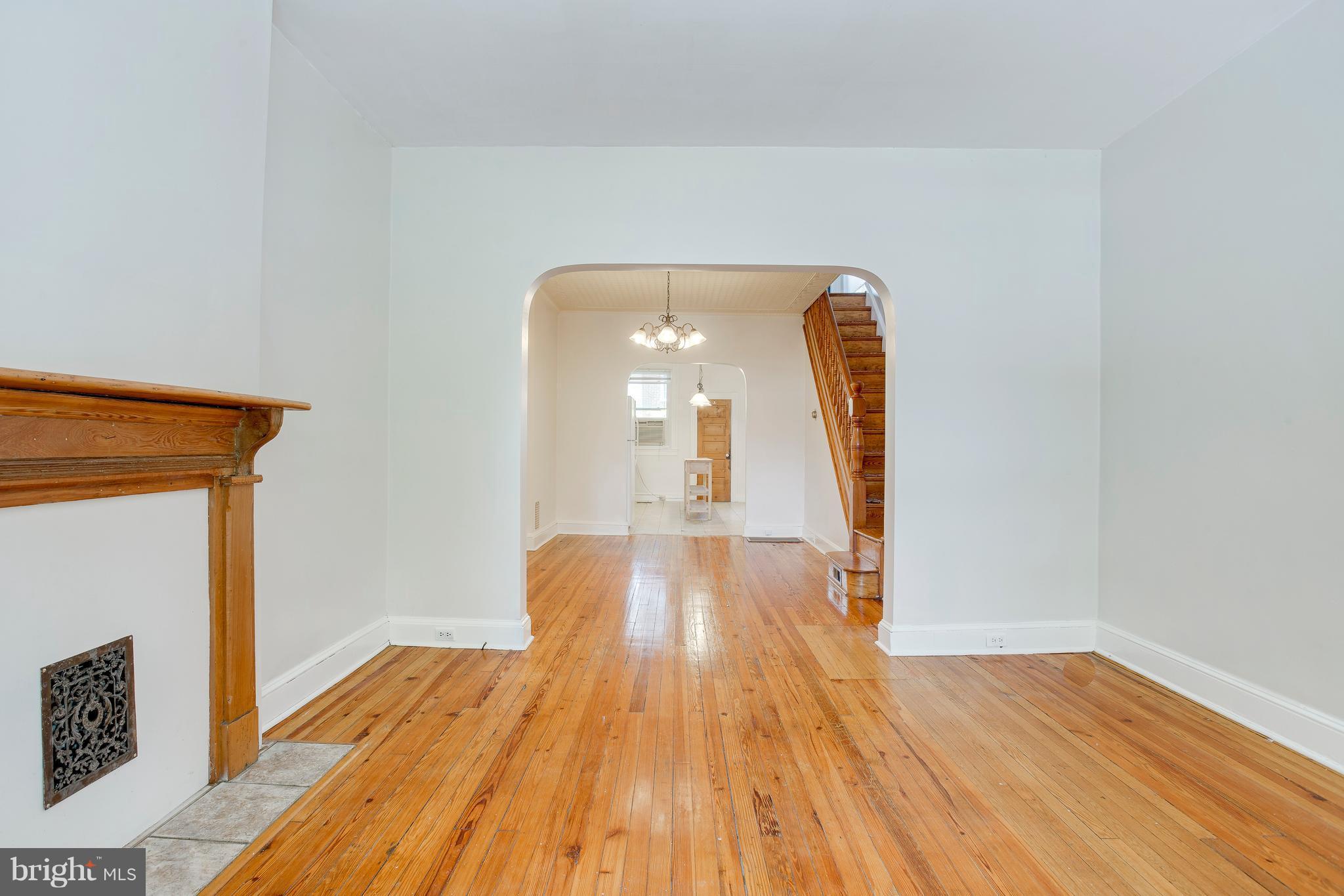 4119 Falls Road Baltimore, MD 21211 - Photo 5 of 23 long sight line from living room to the kitchen