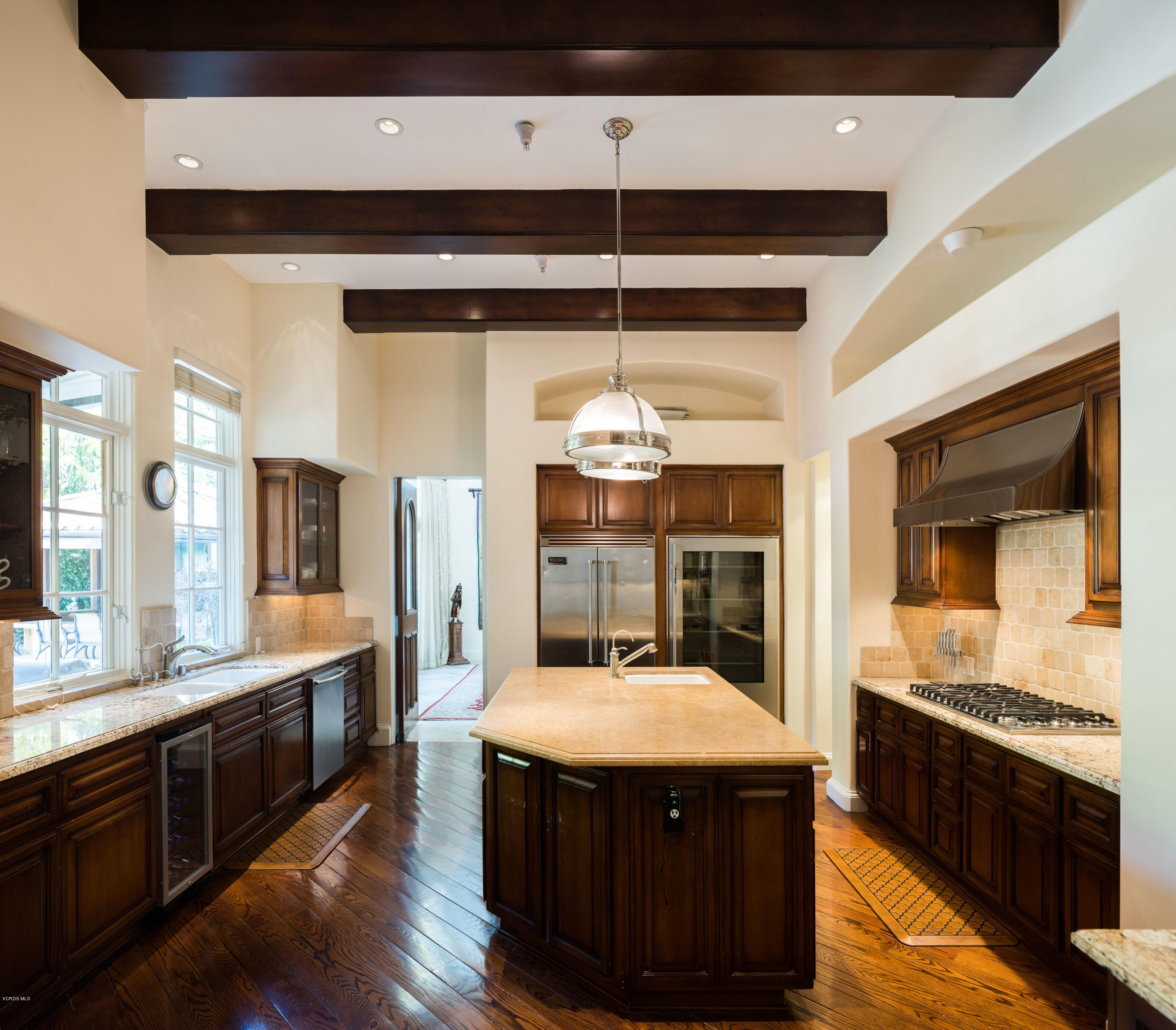 14003 Aubrey Road Beverly Hills, CA 90210 - Photo 17 of 49 a kitchen with a stove and a refrigerator