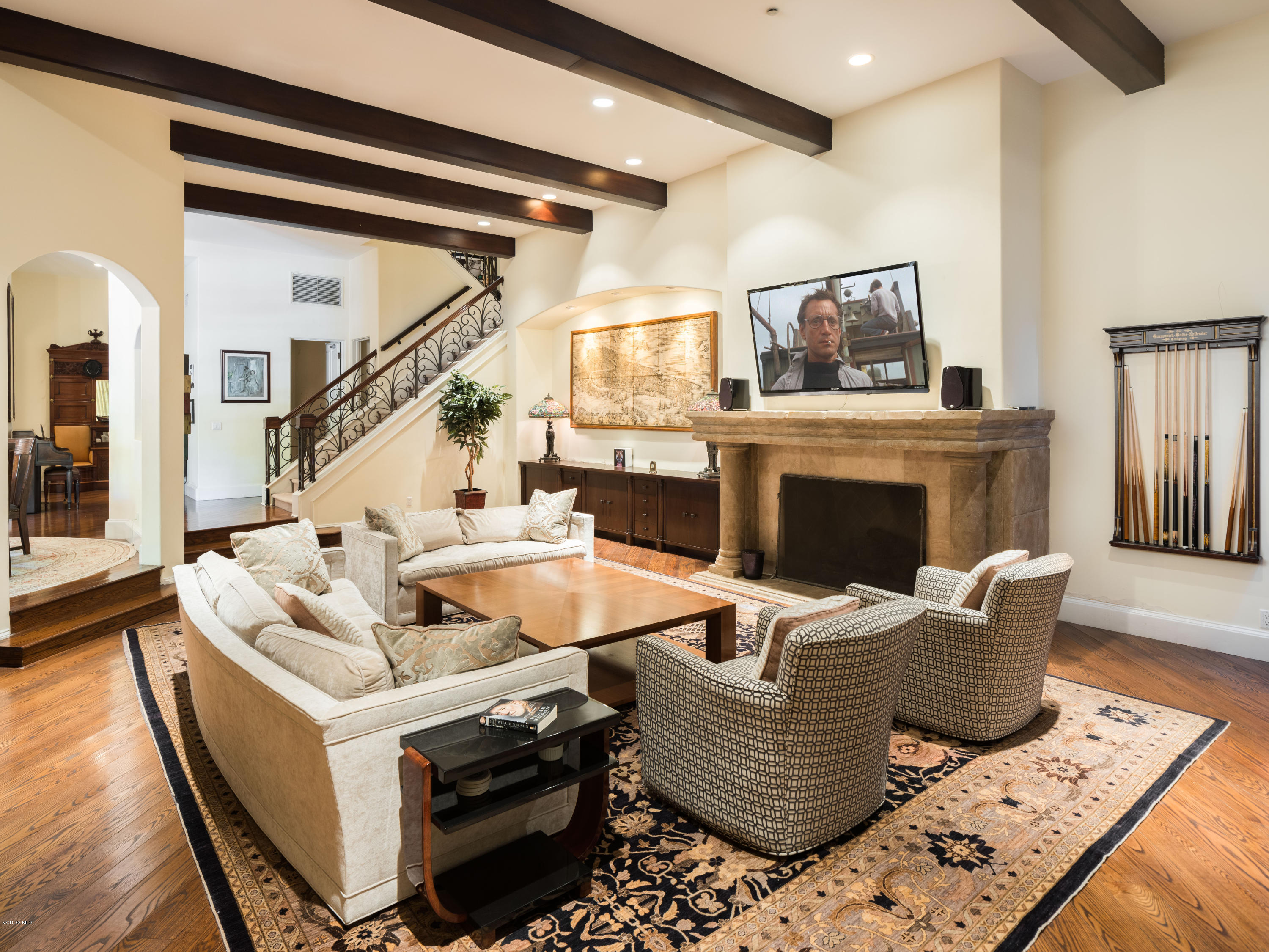 14003 Aubrey Road Beverly Hills, CA 90210 - Photo 19 of 49 a living room with furniture and a fireplace