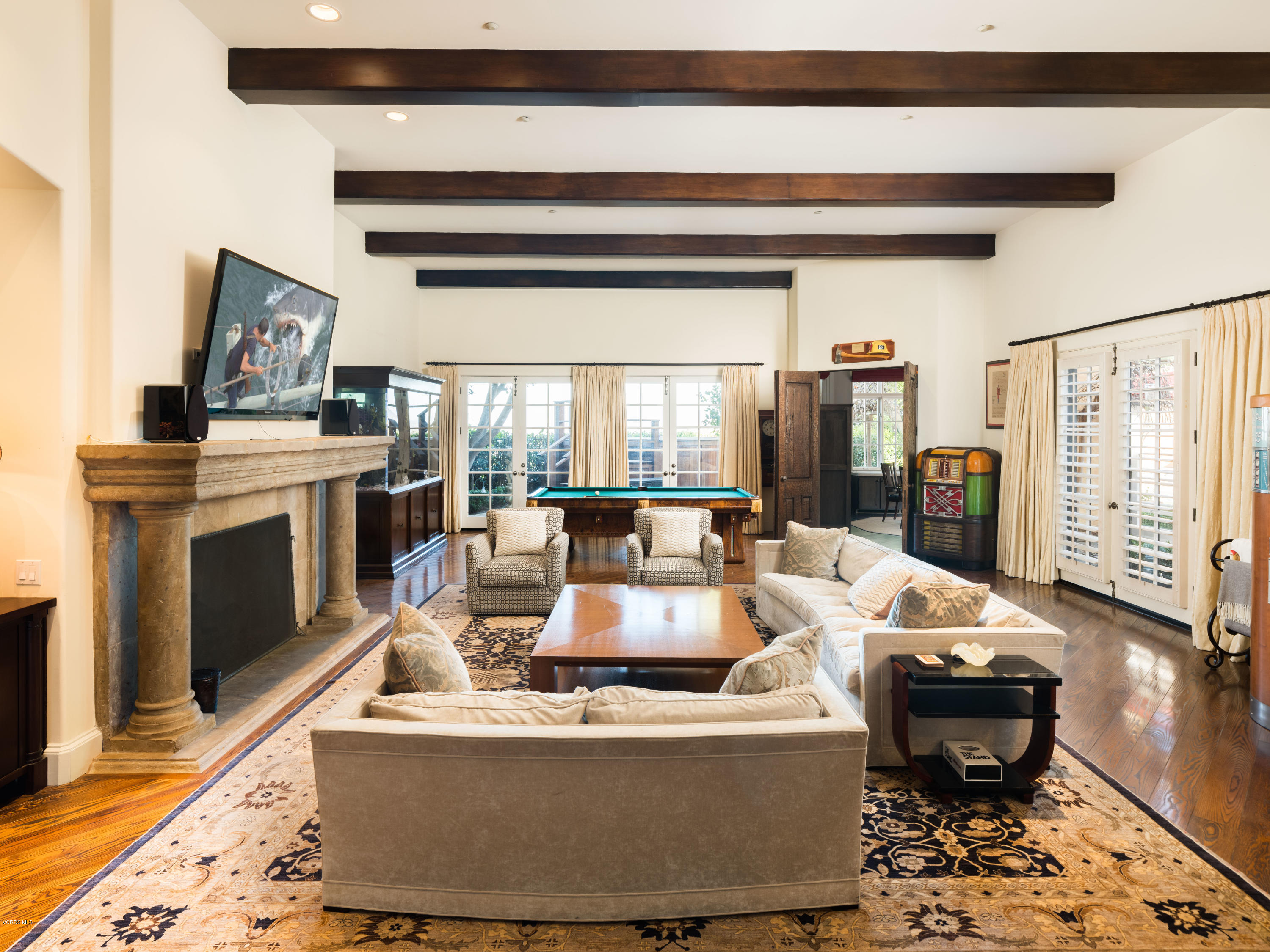 14003 Aubrey Road Beverly Hills, CA 90210 - Photo 20 of 49 a living room with furniture and a fireplace