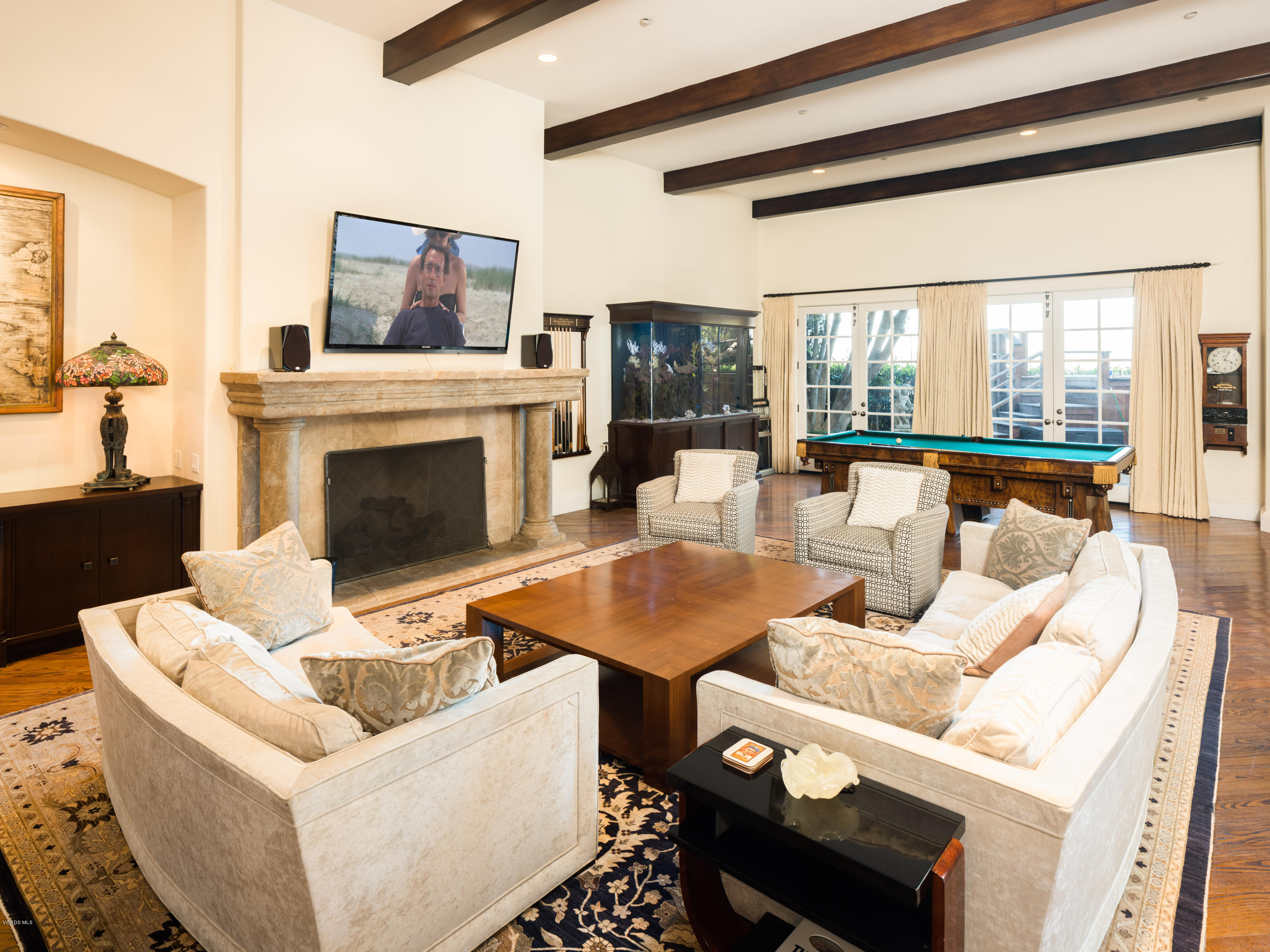 14003 Aubrey Road Beverly Hills, CA 90210 - Photo 21 of 49 a living room with furniture and a fireplace