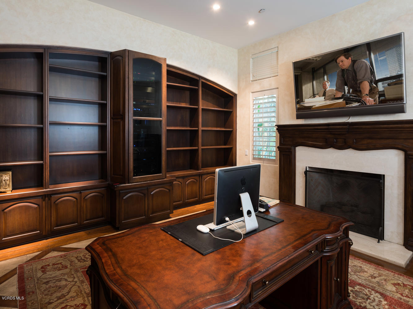 14003 Aubrey Road Beverly Hills, CA 90210 - Photo 25 of 49 a living room with furniture and a fireplace