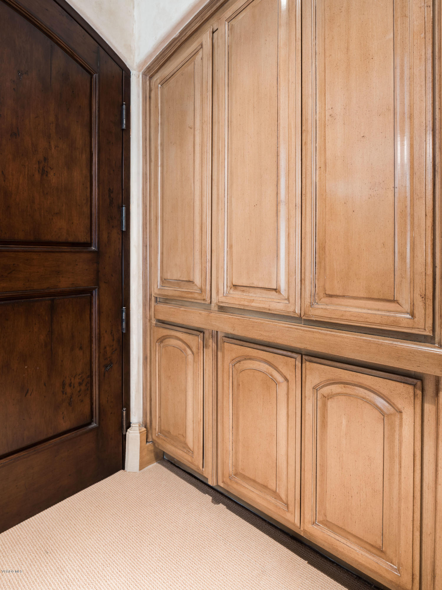 14003 Aubrey Road Beverly Hills, CA 90210 - Photo 29 of 49 a view of a cabinet with mirror