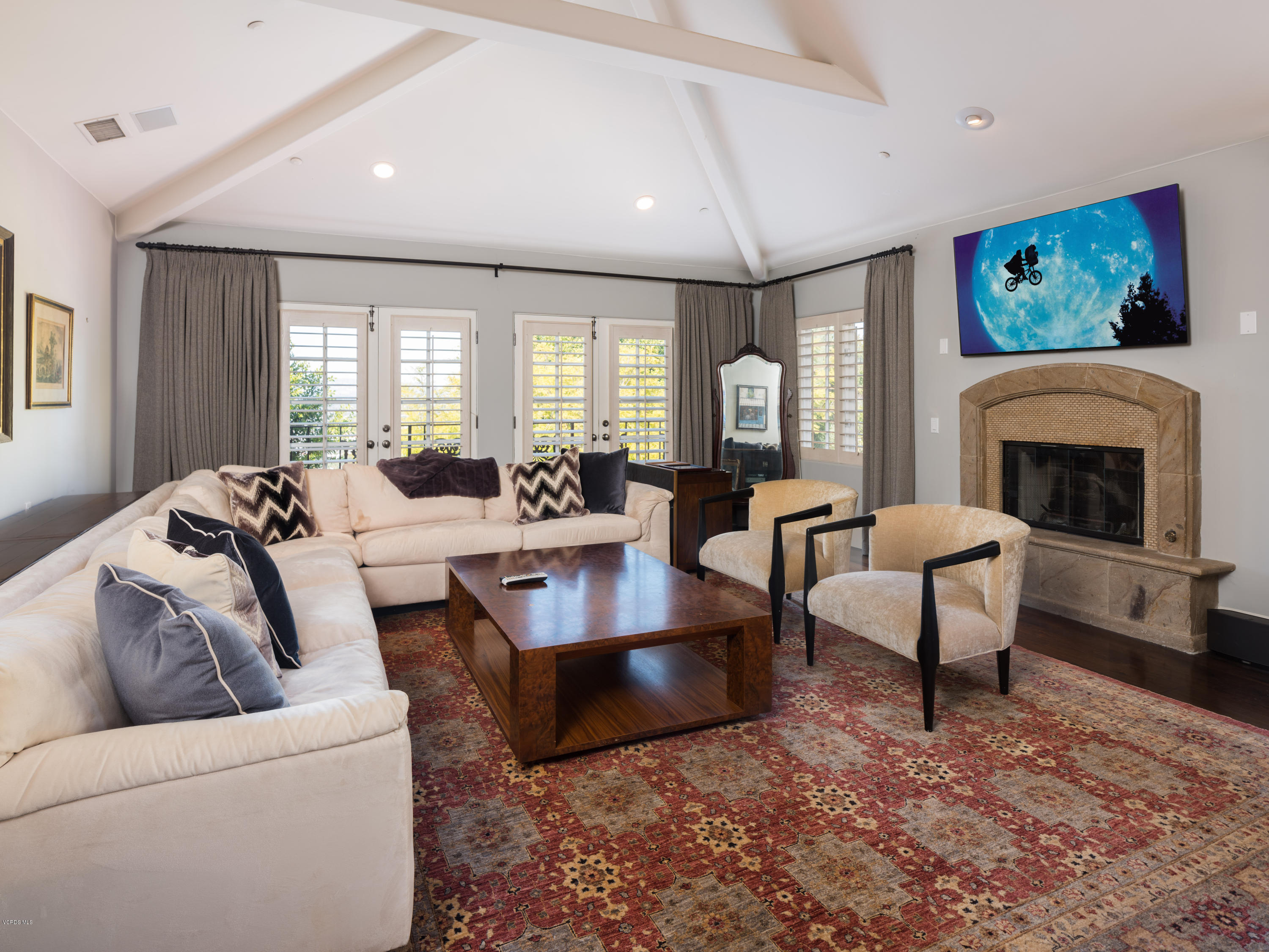 14003 Aubrey Road Beverly Hills, CA 90210 - Photo 32 of 49 a living room with furniture and a fireplace