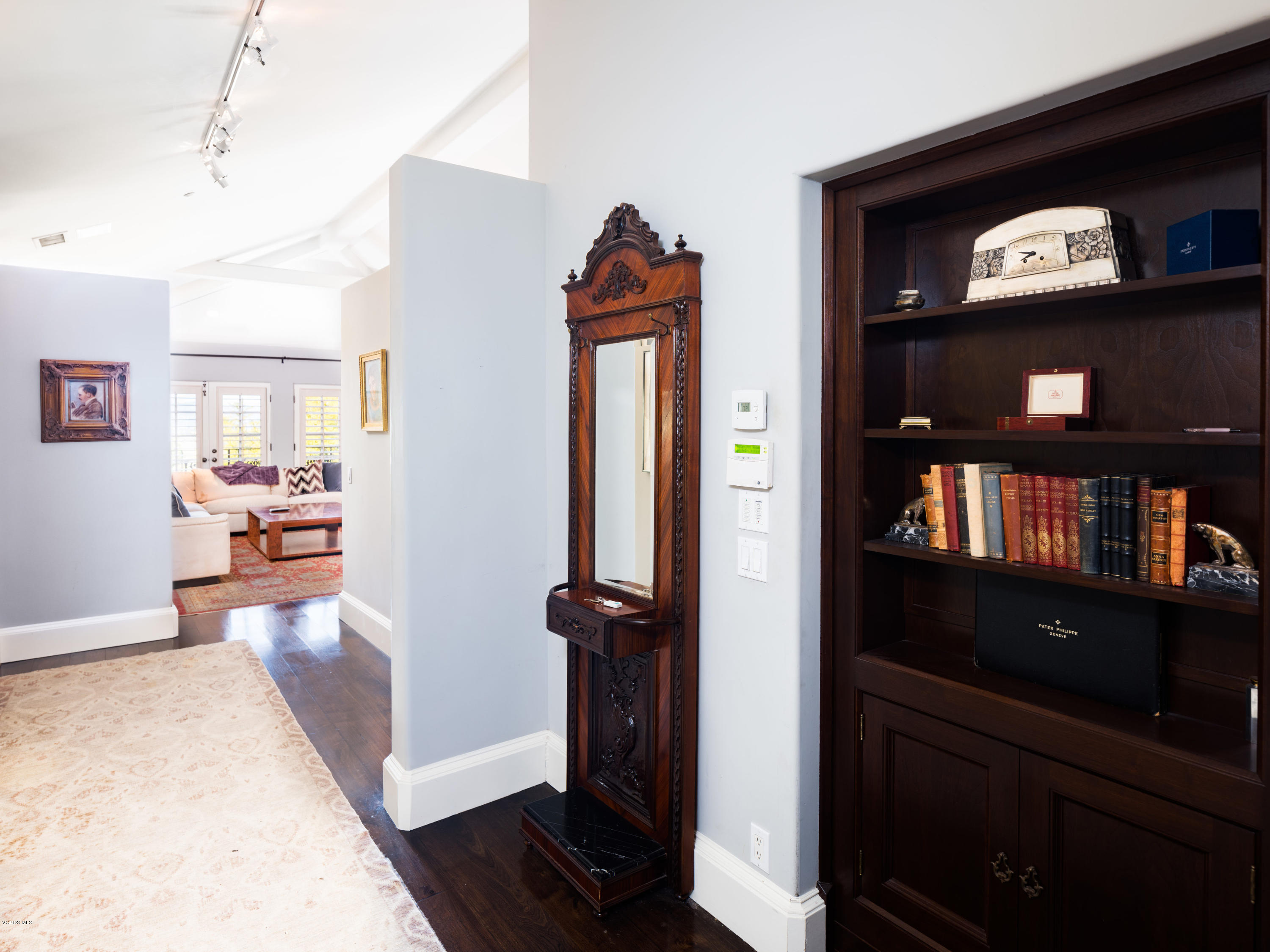 14003 Aubrey Road Beverly Hills, CA 90210 - Photo 34 of 49 a view of a hallway to room with wooden floor and furniture