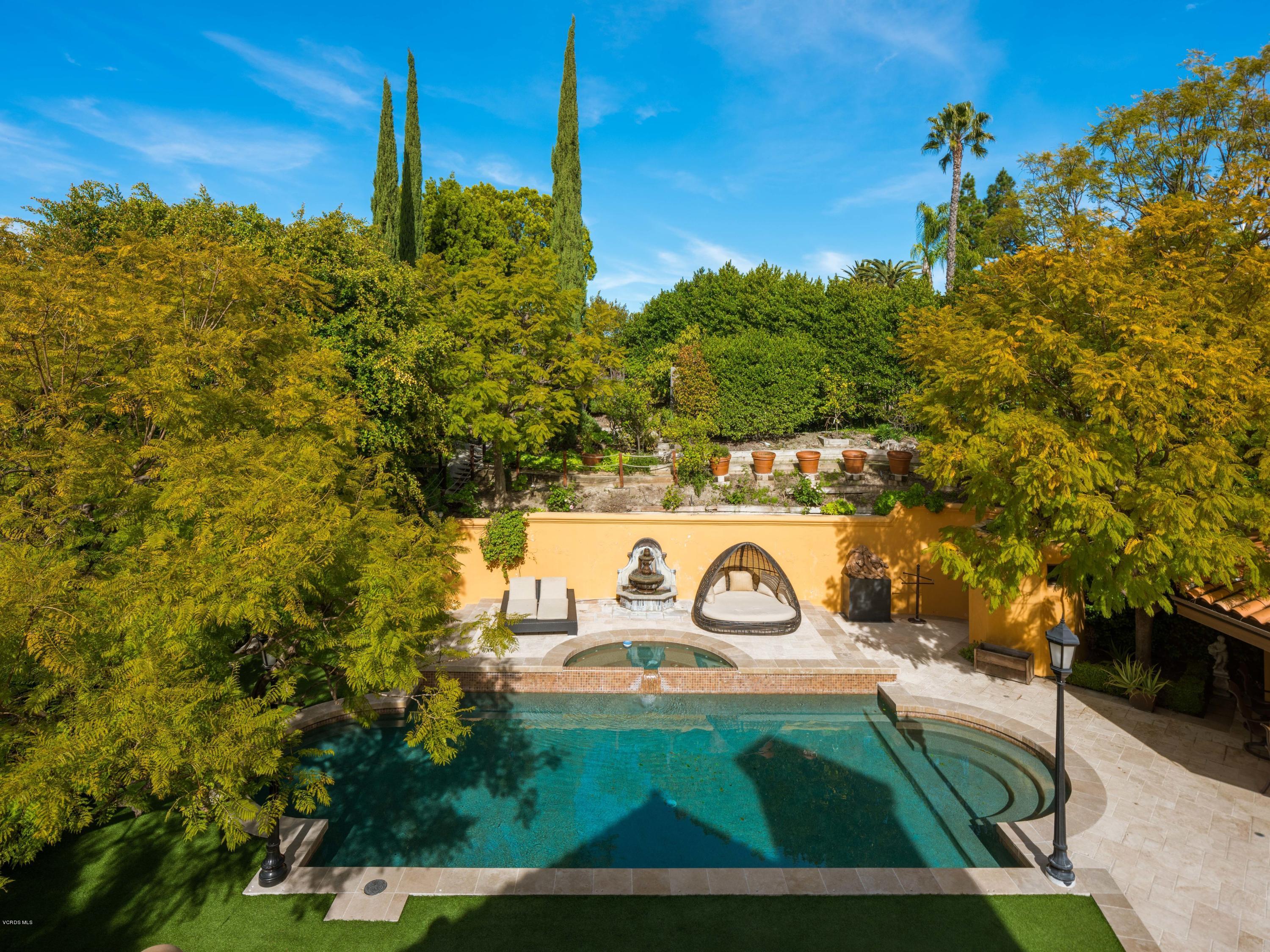 14003 Aubrey Road Beverly Hills, CA 90210 - Photo 39 of 49 a view of a wooden door with a tree in the background