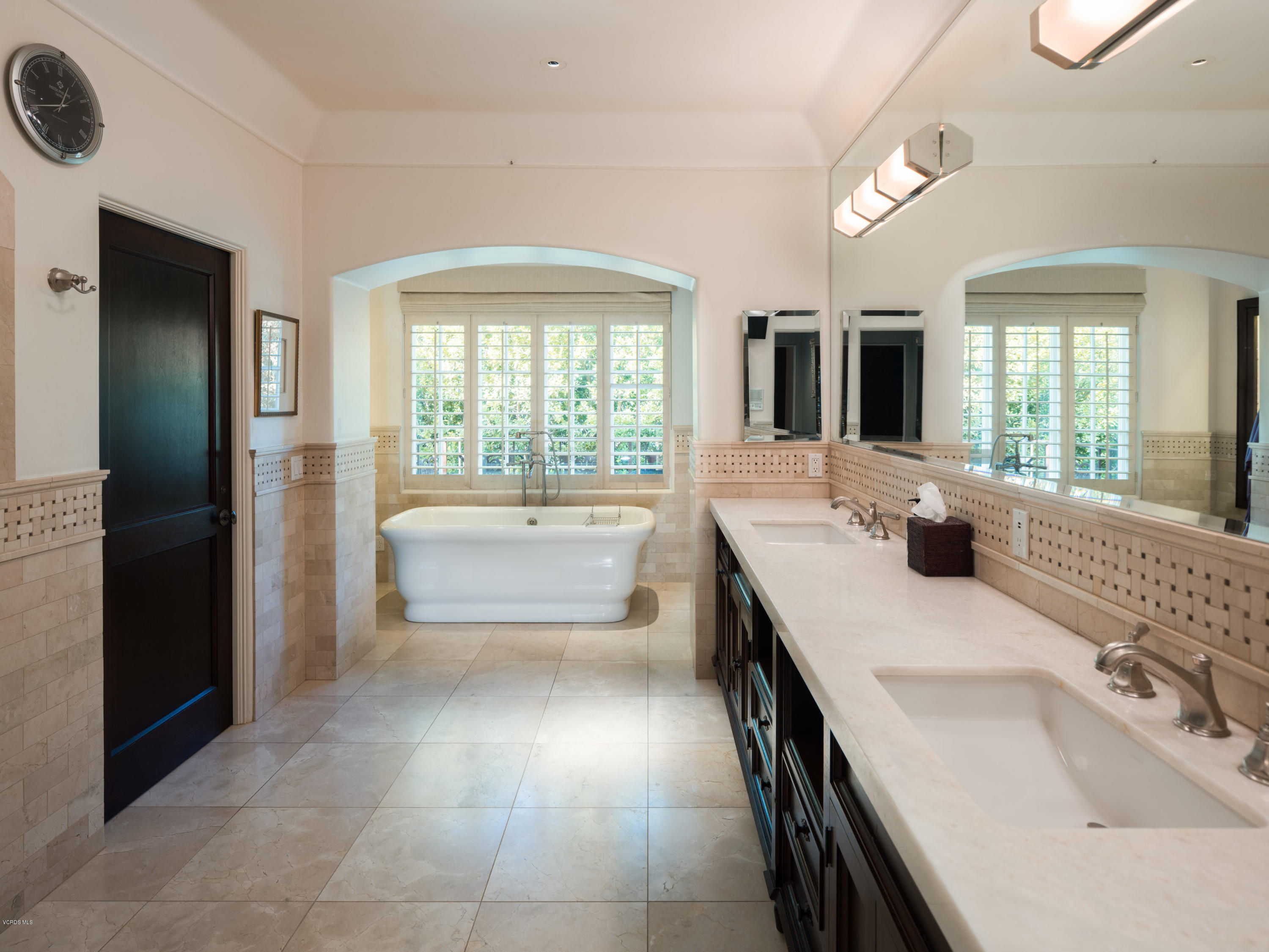14003 Aubrey Road Beverly Hills, CA 90210 - Photo 40 of 49 a bathroom with a tub a sink and mirror