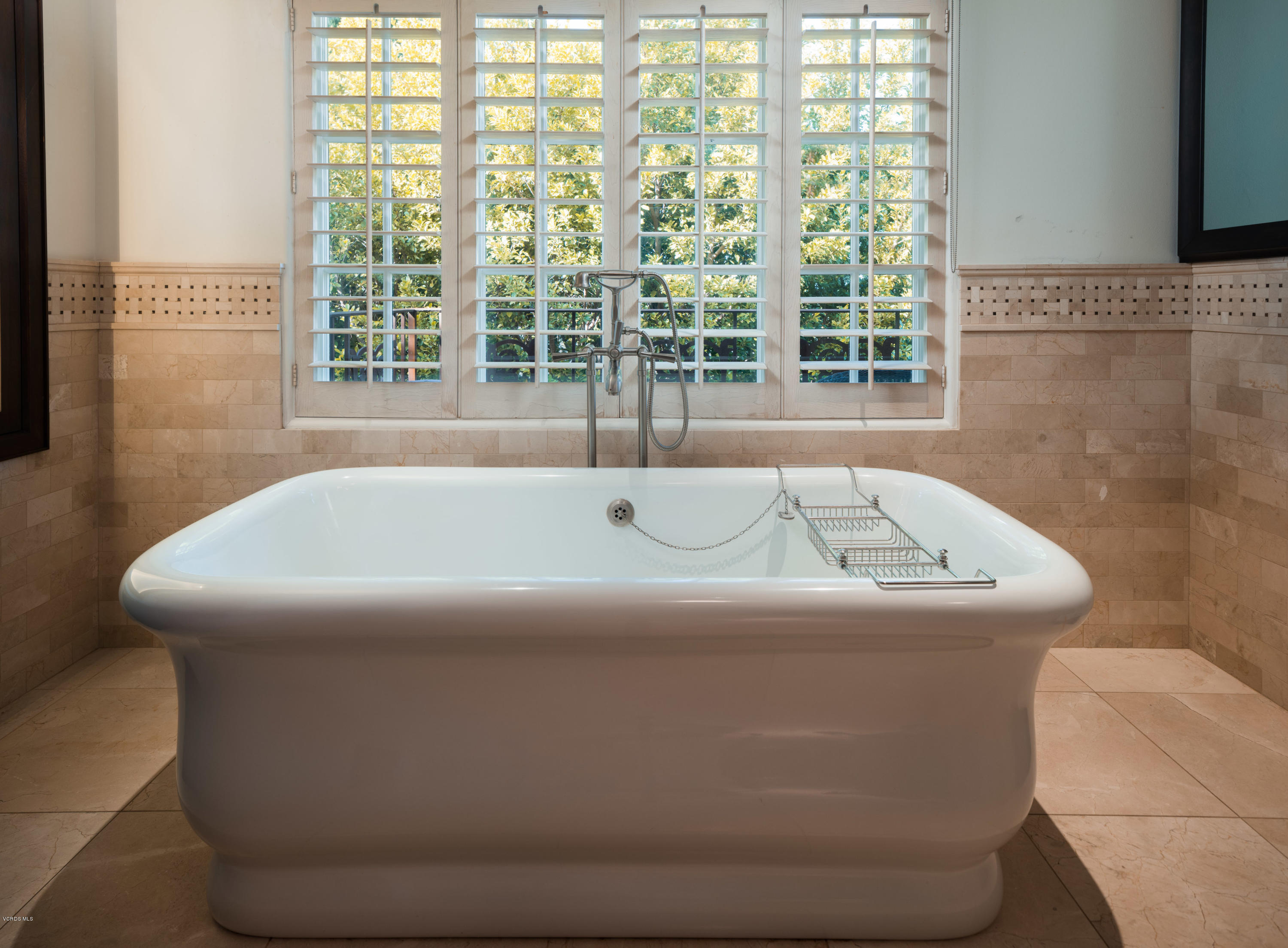 14003 Aubrey Road Beverly Hills, CA 90210 - Photo 41 of 49 a bath tub sitting in a bathroom next to a window