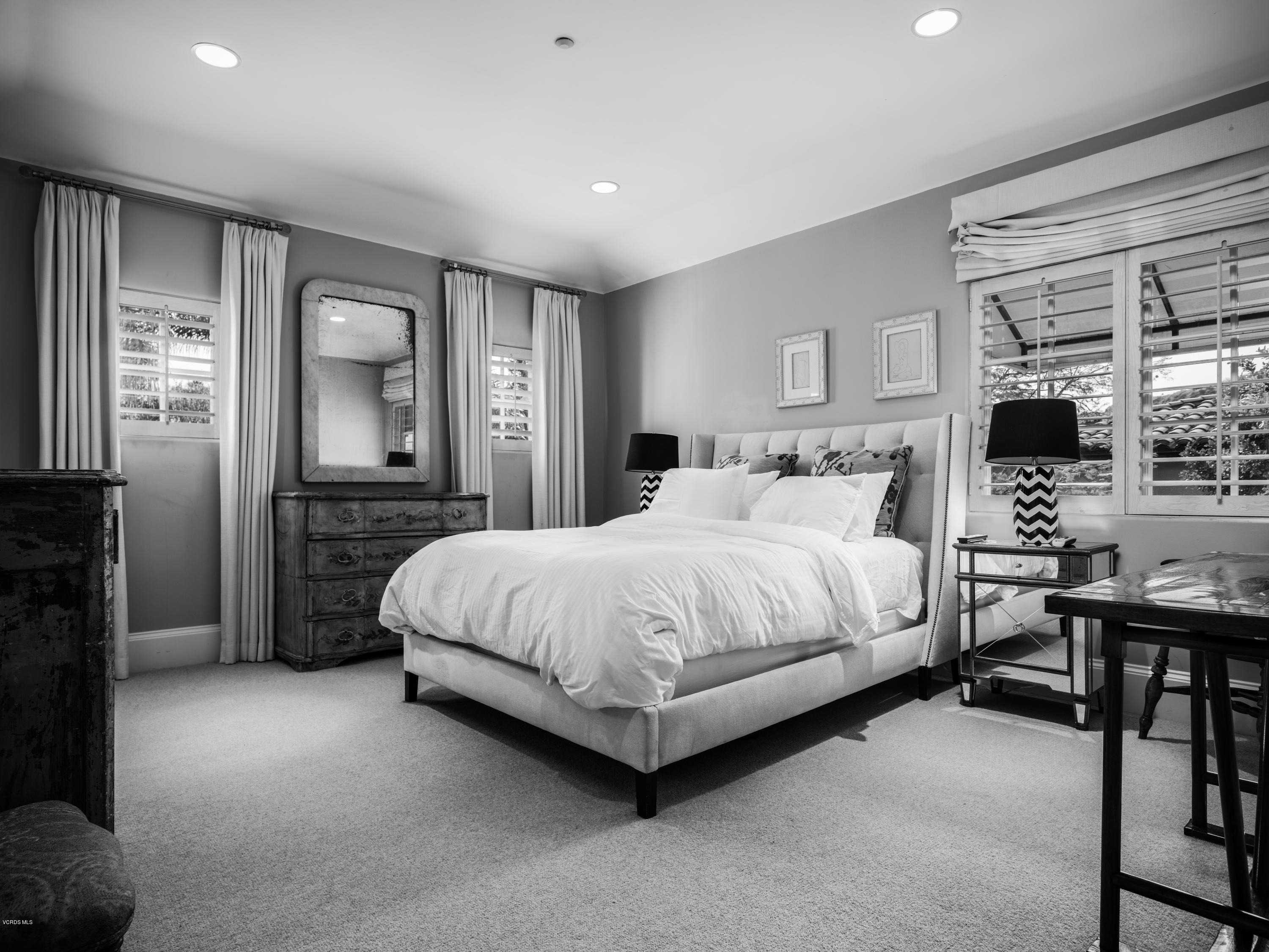 14003 Aubrey Road Beverly Hills, CA 90210 - Photo 43 of 49 a spacious bedroom with a bed a couch and dresser