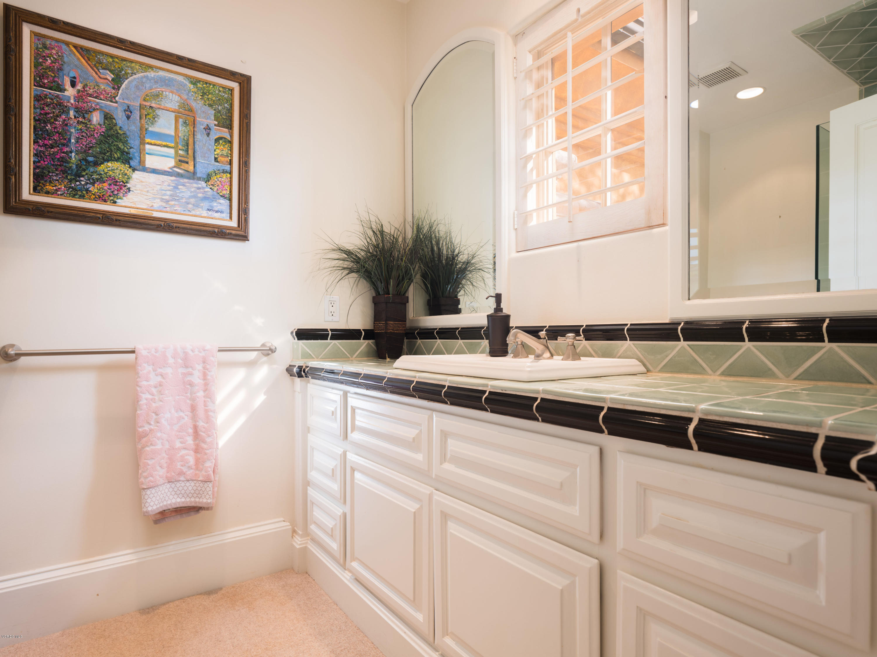 14003 Aubrey Road Beverly Hills, CA 90210 - Photo 44 of 49 a bathroom with a sink and a mirror