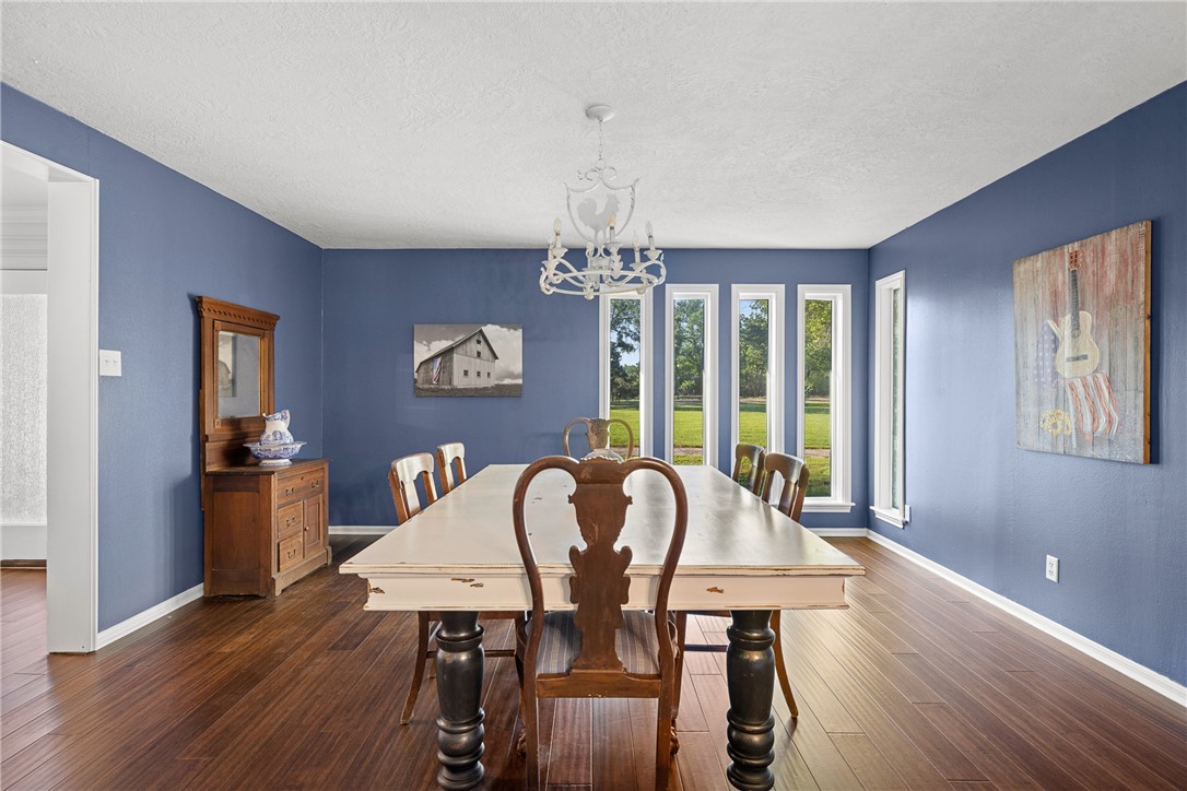 871 Cazey Loop Franklin, TX 77856 - Photo 9 of 42 a view of a dining room with furniture window and wooden floor